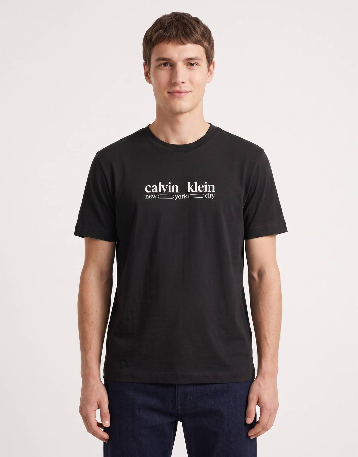 Front view of a men's Calvin Klein 30s WHSL NYC Graphic Black T-Shirt, featuring a white 'Calvin Klein new york city' logo
