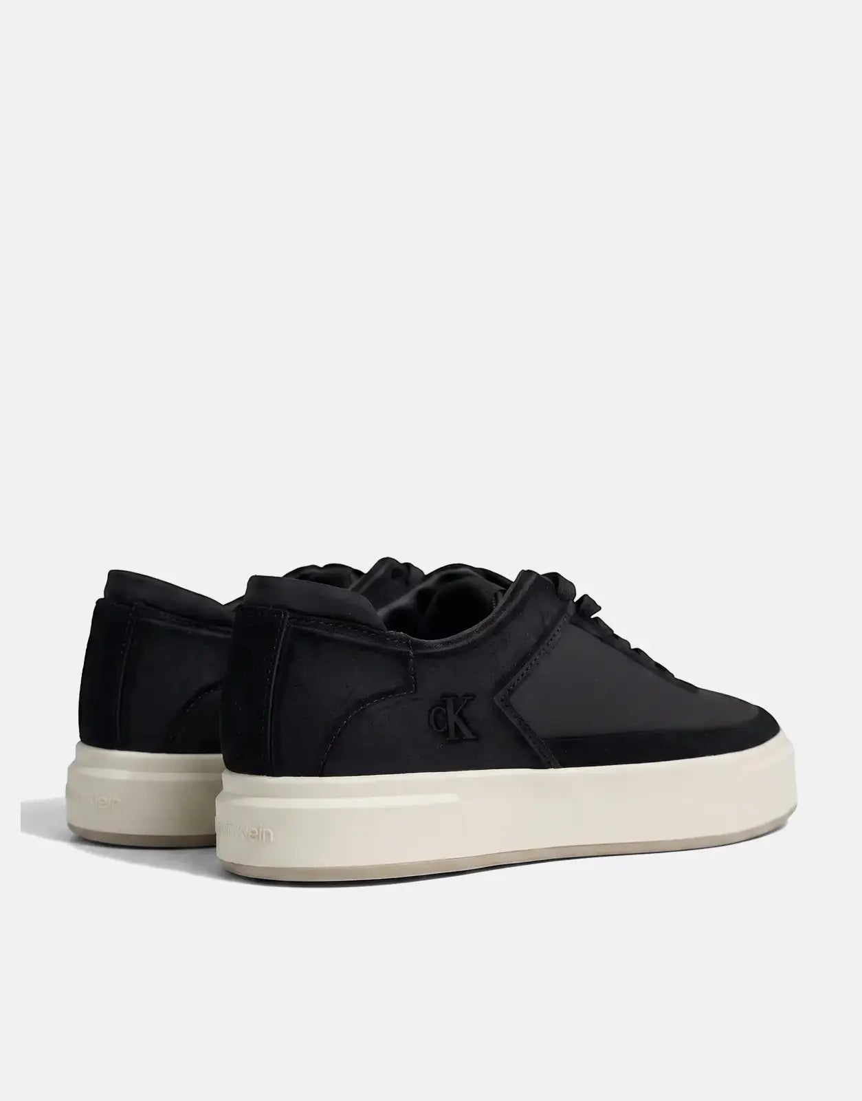 Calvin Klein Basket Cupsole black multi lace-up sneakers, side-back view, with a thick cream platform sole.