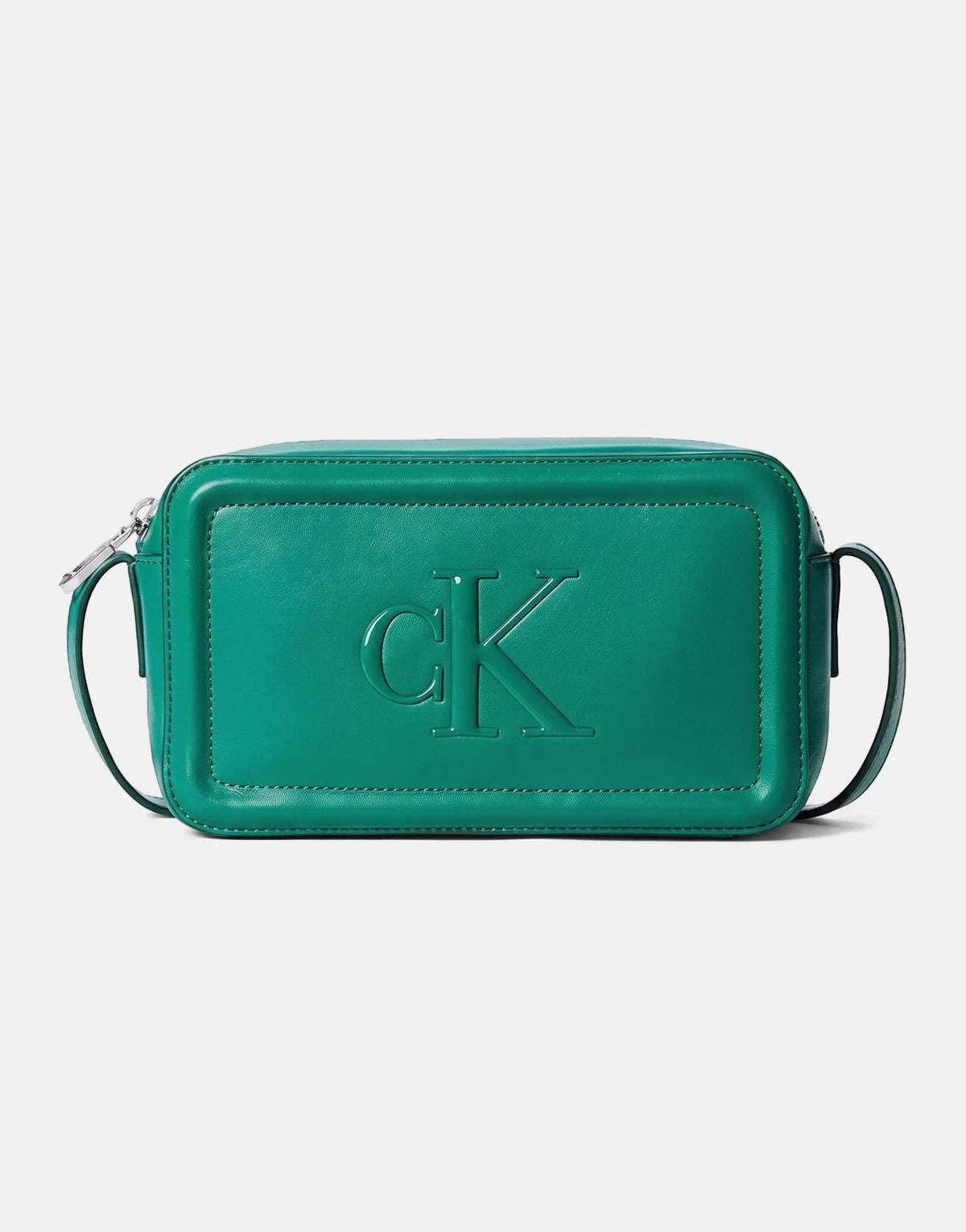 A bold emerald green Calvin Klein camera bag with an embossed CK logo, shown from a front view.