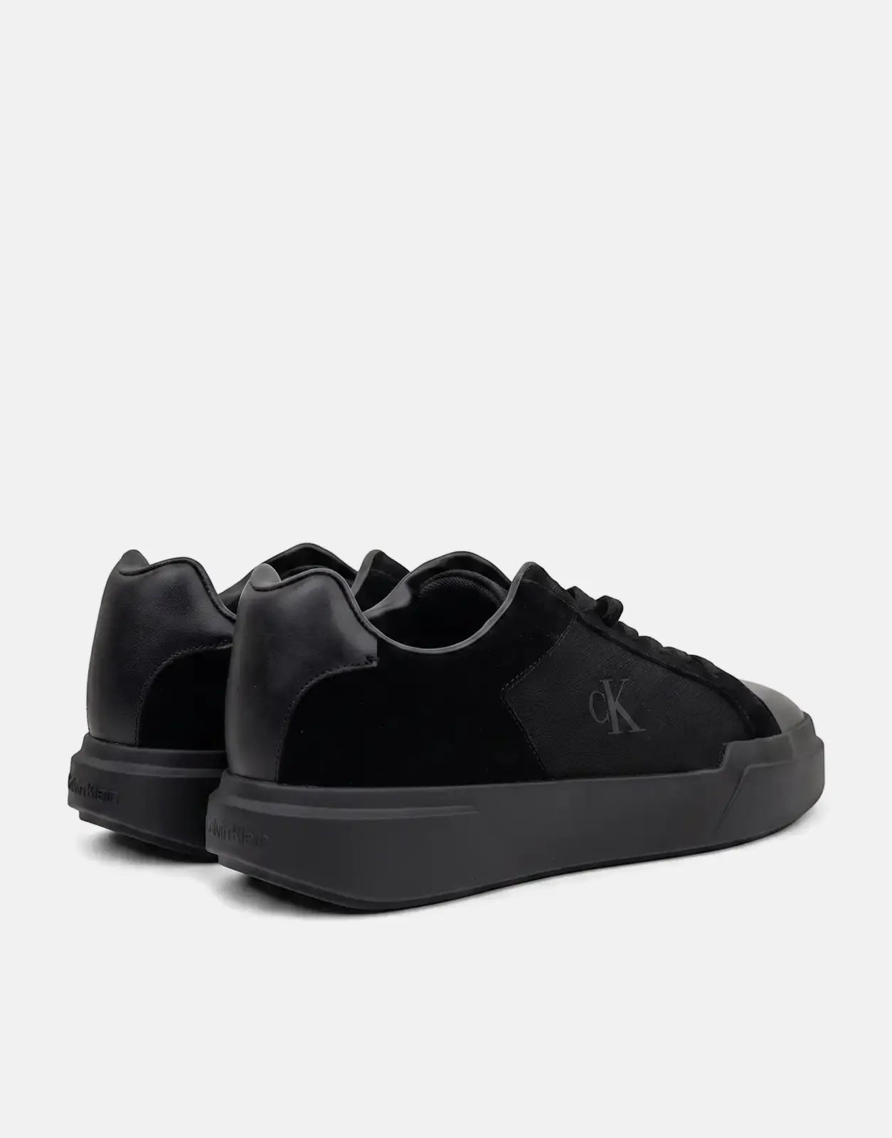Calvin Klein Chunky Cupsole Laceup Black Sneakers from a rear-right angle, showcasing the 'CK' logo and chunky sole detail.
