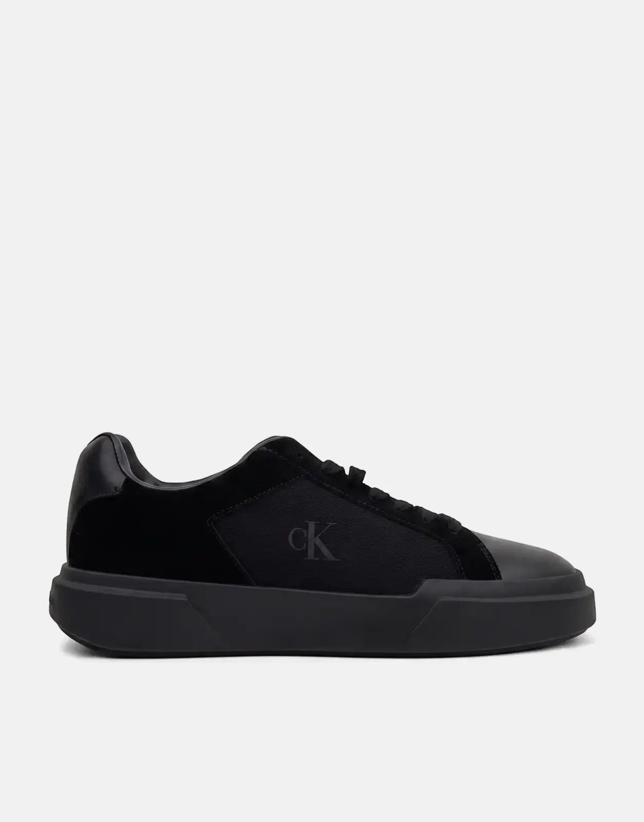 Calvin Klein Chunky Cupsole Laceup Black Sneakers in a side profile view, showcasing the mixed material upper and thick sole.