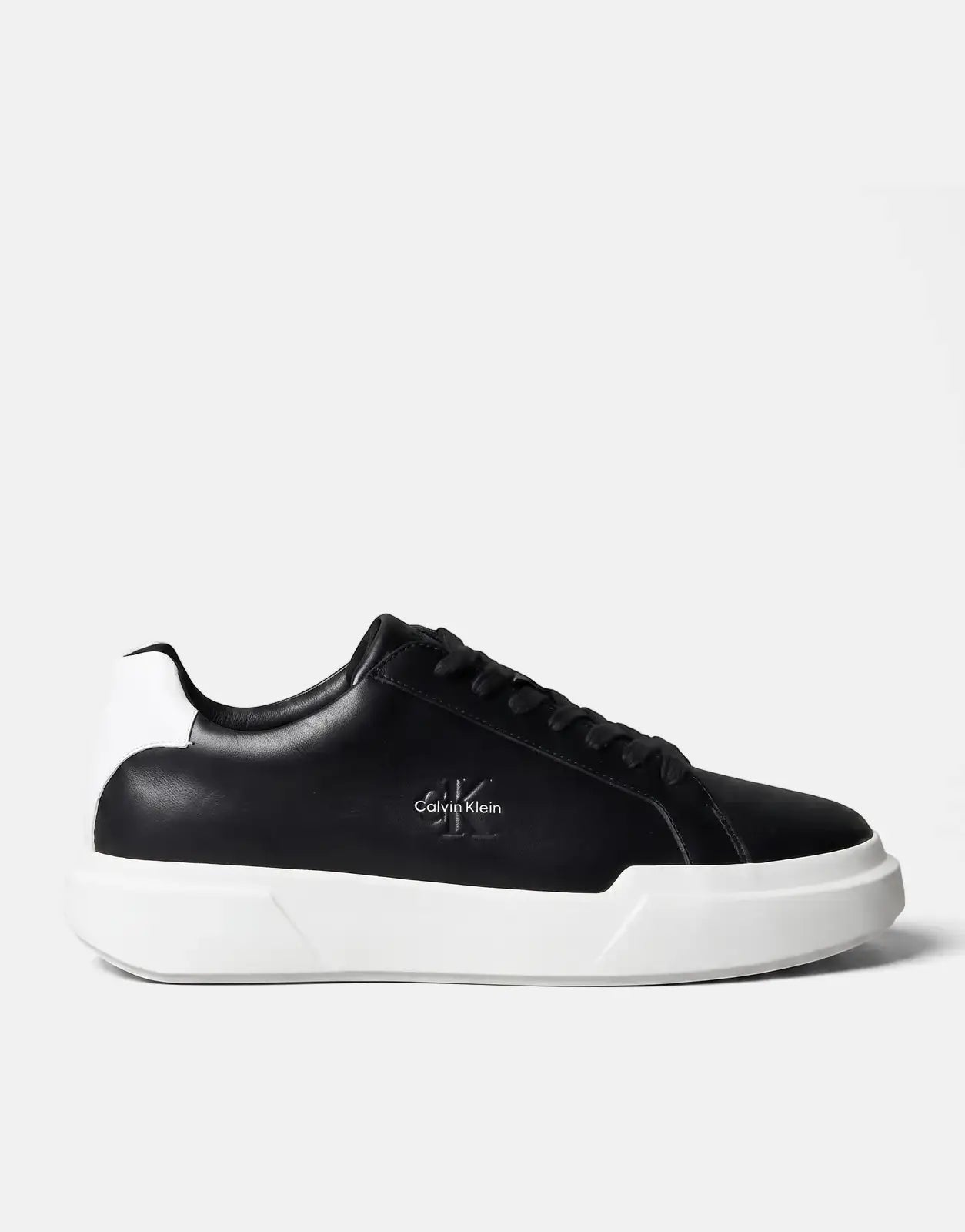 Calvin Klein Chunky Cupsole Sneaker in black and white, featuring a low-top design, shown from a side view.