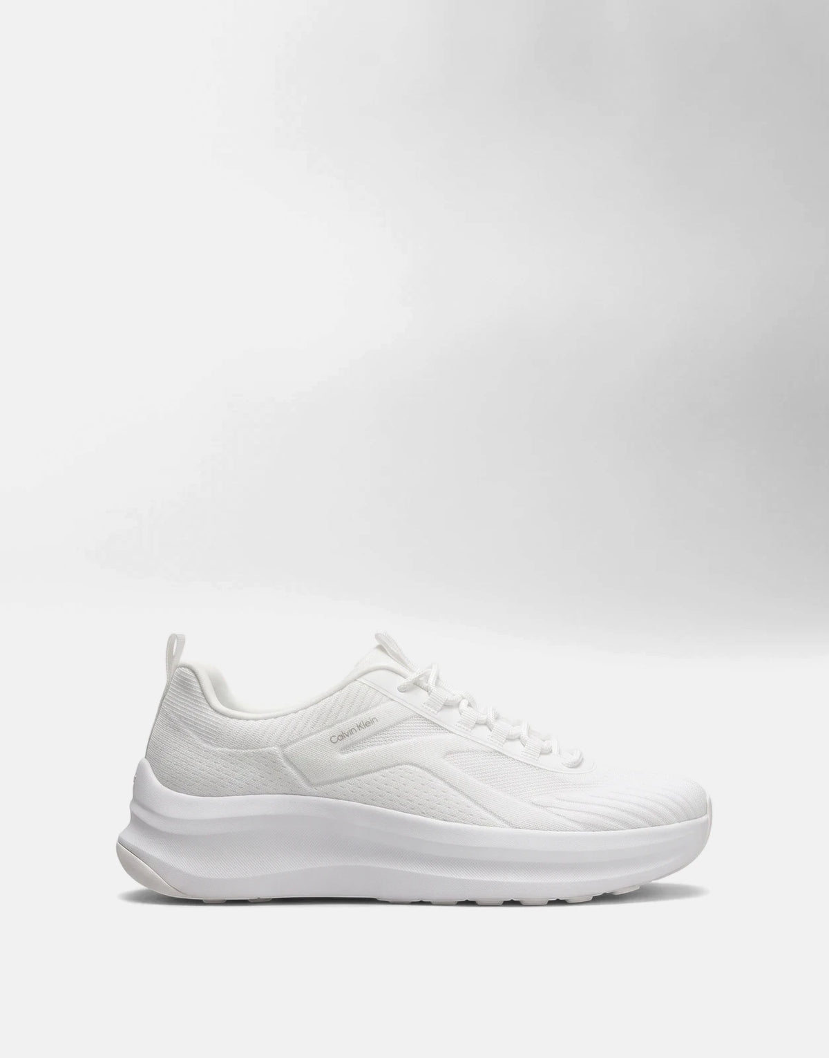 White Calvin Klein Chunky Run Lacesock Stripe sneaker with a chunky sole, shown from a side view.