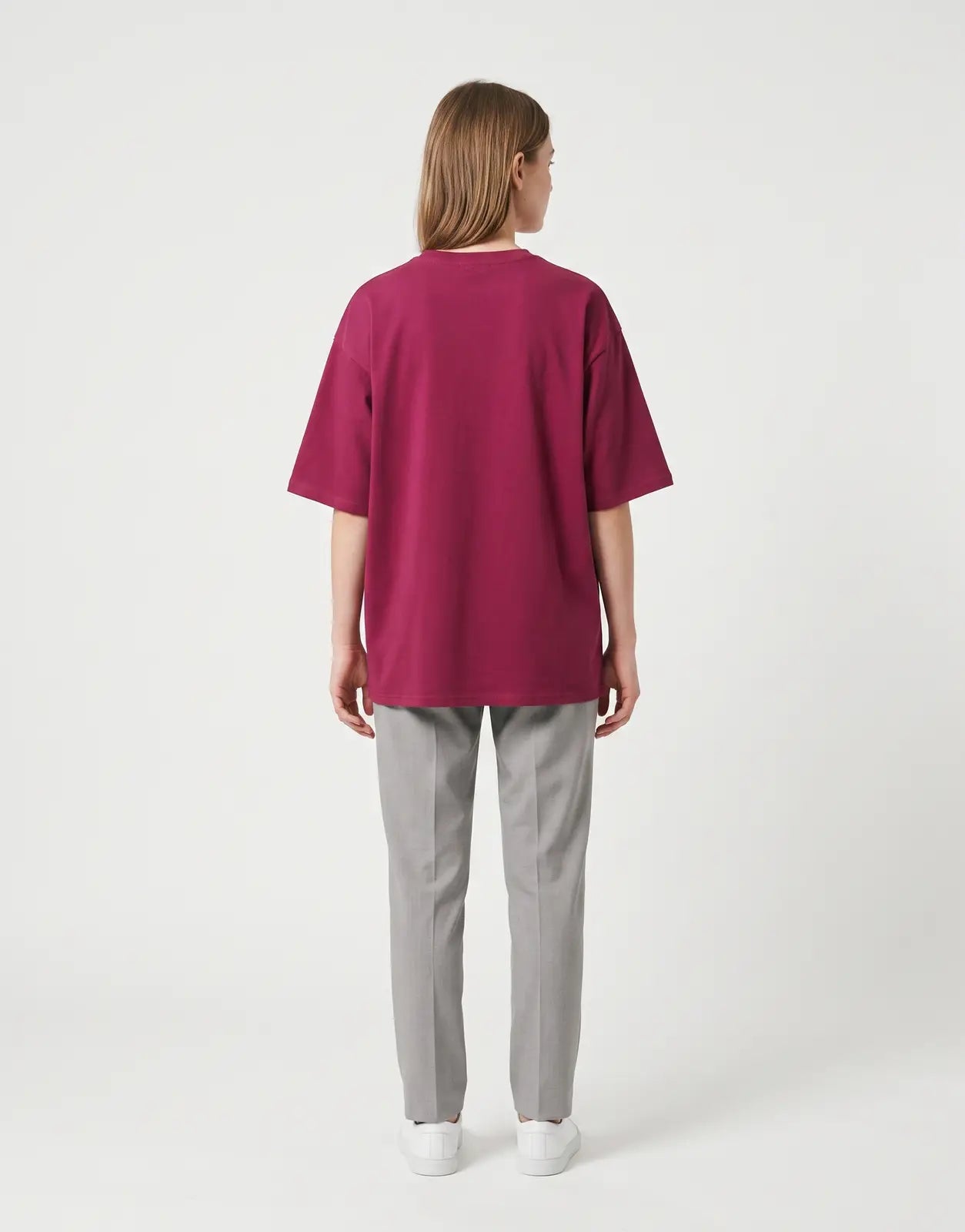 A women's Calvin Klein CK NY oversized t-shirt in a rich berry color, laid flat on a white surface, showcasing the back view