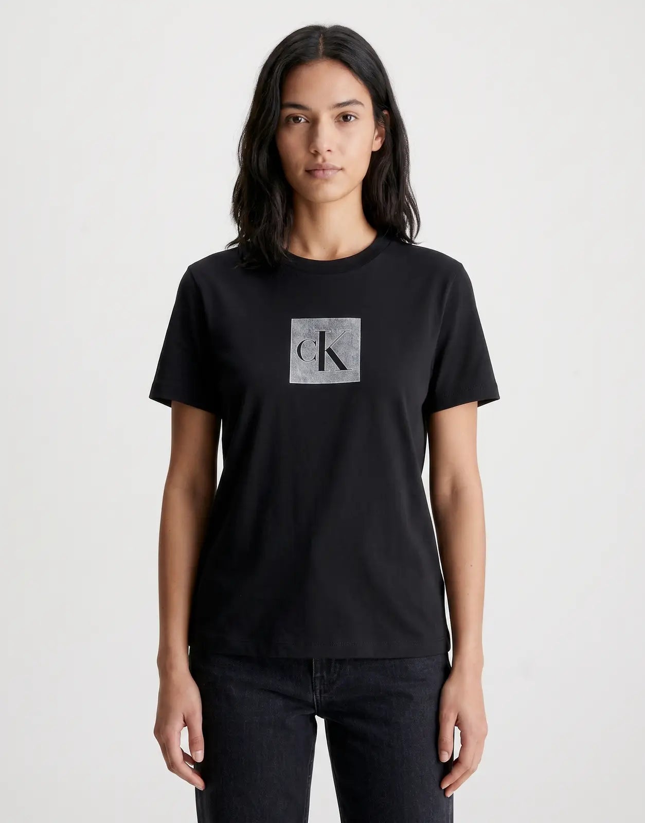 Front view of a black Calvin Klein Classic Fit Monogram T-Shirt with short sleeves and a crew neck, featuring a grey 'CK'