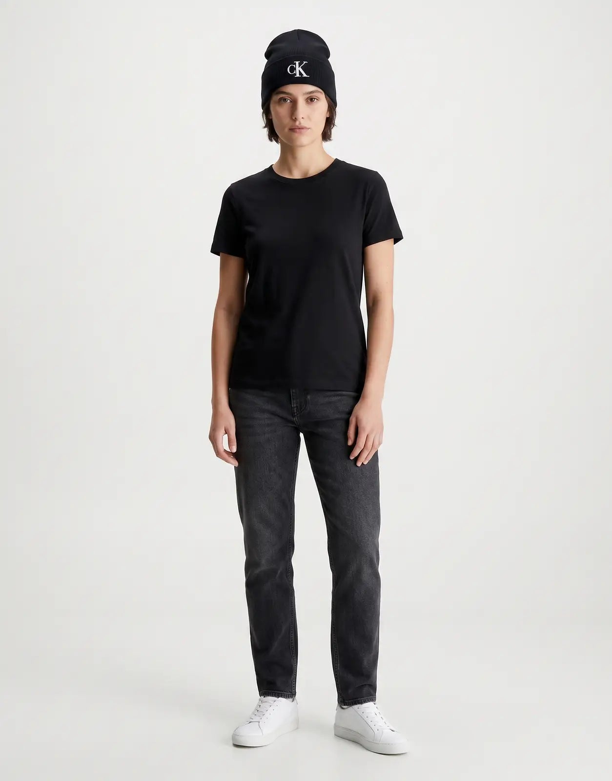 A Calvin Klein Fine Rib Black Beanie with a white 'cK' logo embroidered on the front cuff, presented in a clear front view.
