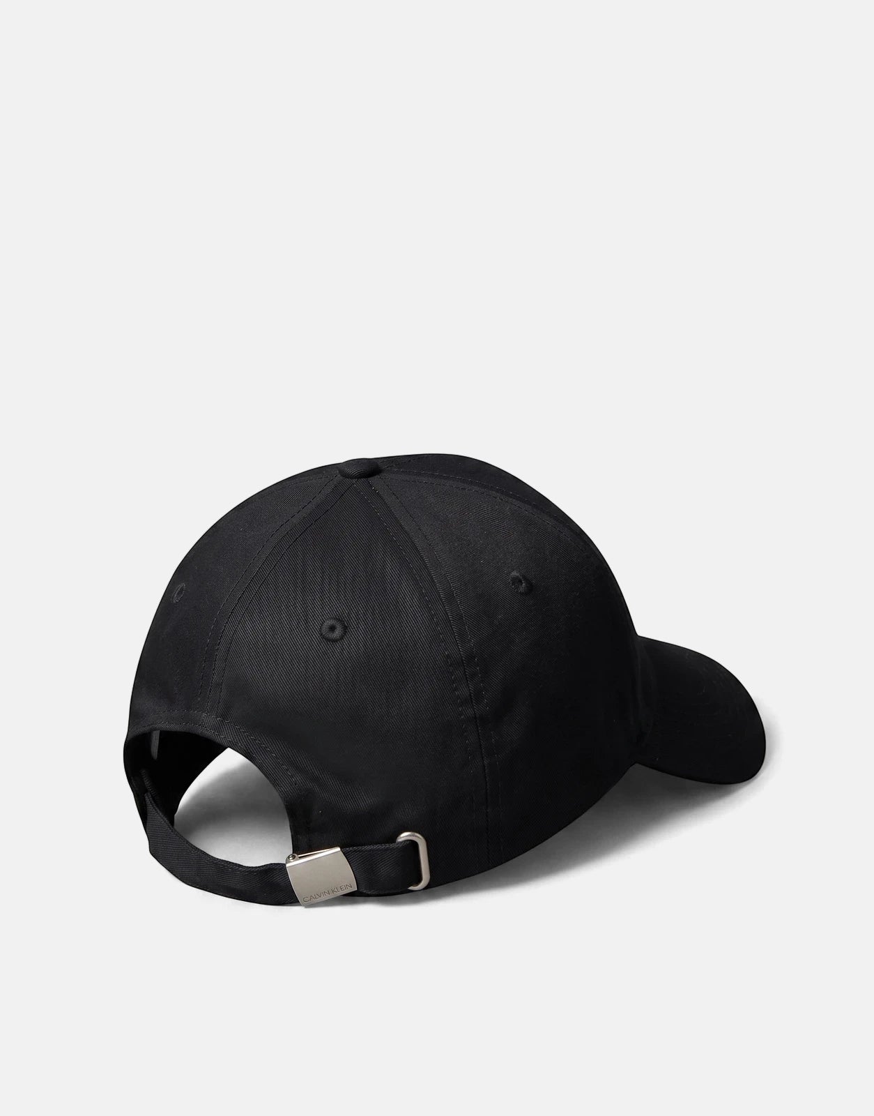 Calvin Klein Heritage Crest Black Patch Cap, rear view, showing adjustable strap with silver buckle. Simple and classic