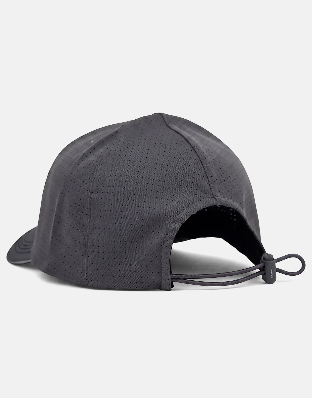 Dark grey Calvin Klein Micro Twill Silicone trucker cap, shown from a back-right view with an adjustable bungee cord.