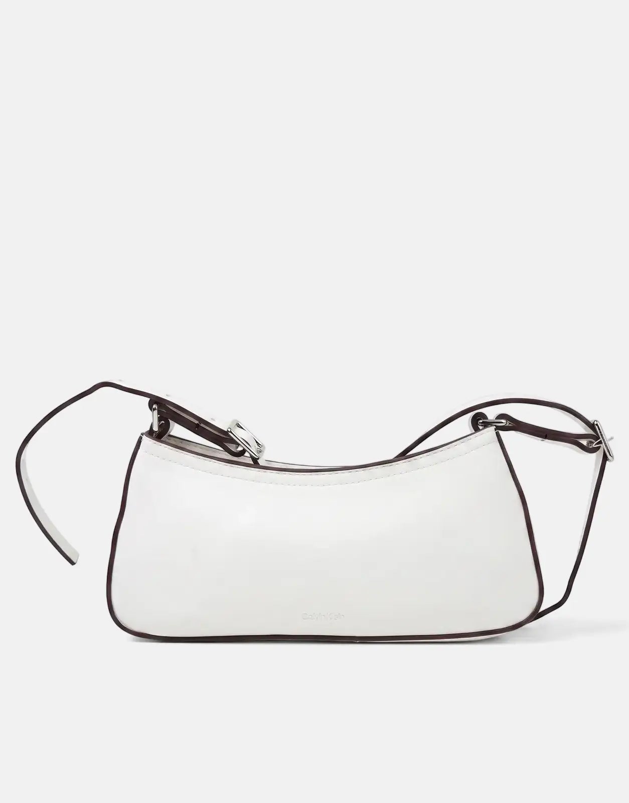 Calvin Klein small white shoulder bag with dark brown trim and silver buckle, viewed from the side.