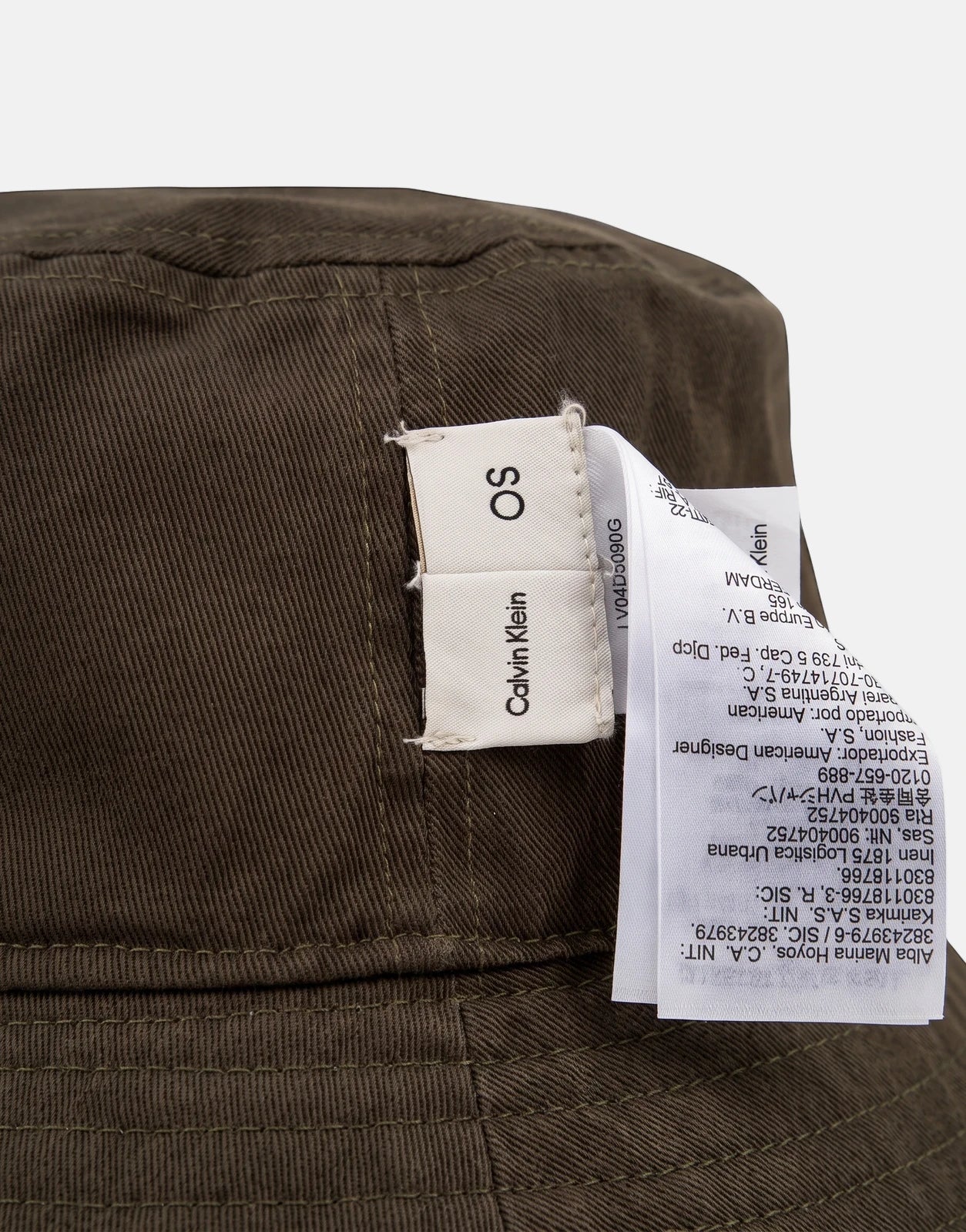 Calvin Klein olive green washed material reversible bucket hat, featuring a visible brand tag and fine stitching details.