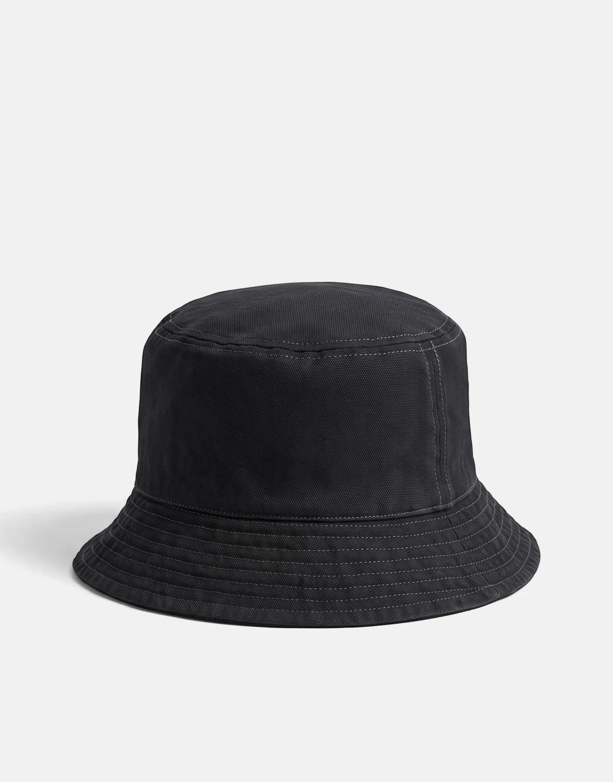 Calvin Klein Washed Material Reversible Black Bucket Hat, shown from an angled perspective.