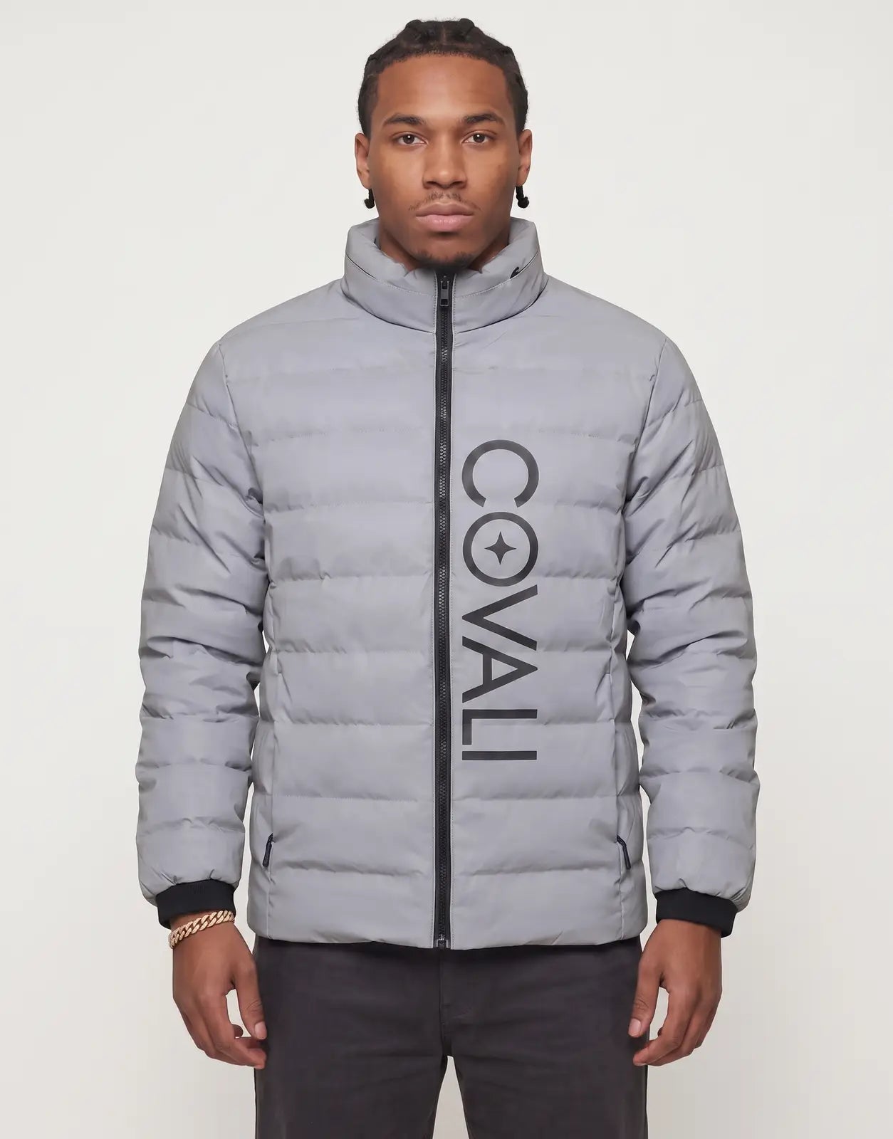 Covali Inverno Puffer Jacket in reflective grey, featuring a full black zip and prominent vertical COVALI star logo.