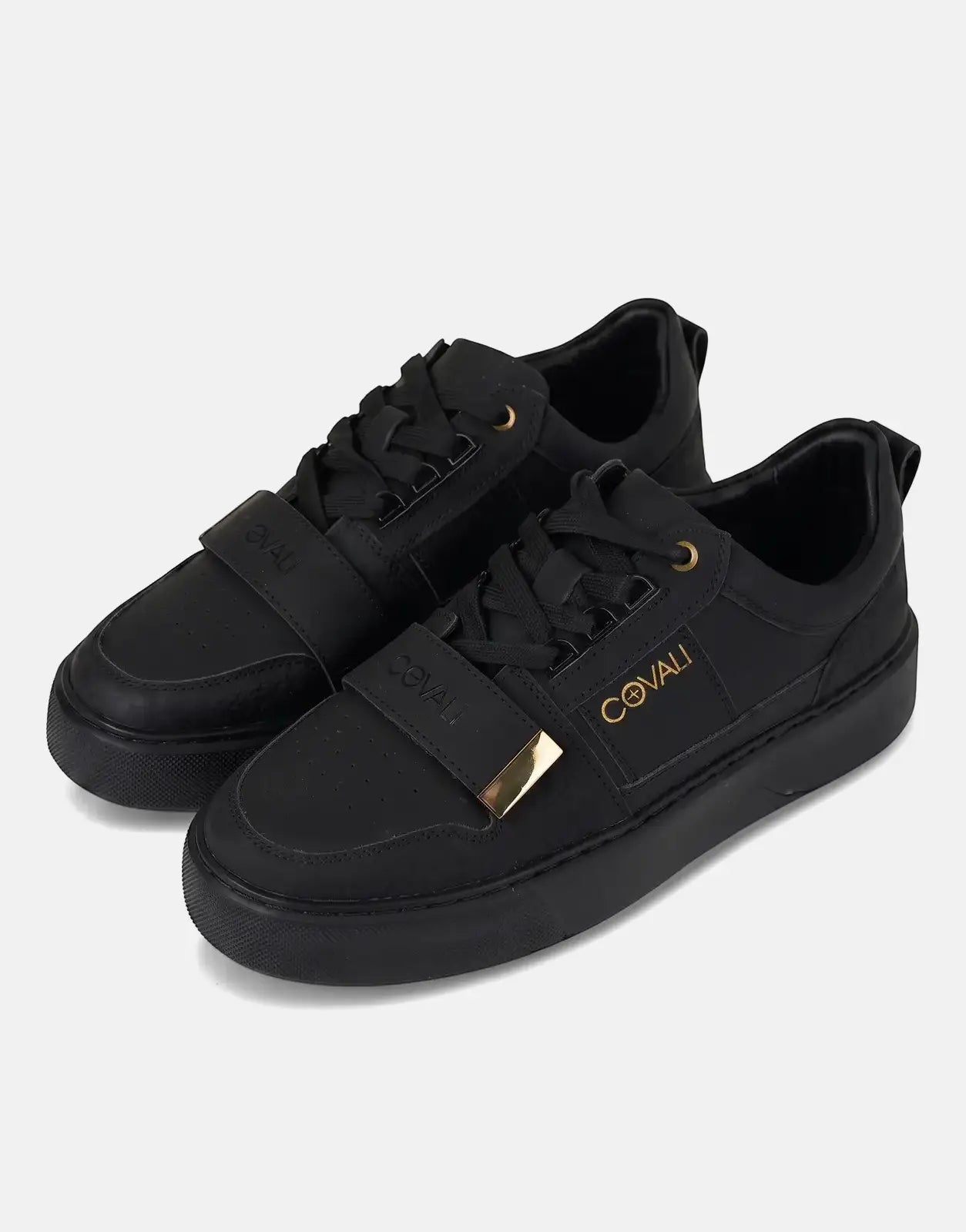 A pair of sleek Covali Moda black low-top sneakers with gold accents, displayed from a slightly elevated side-angle view.