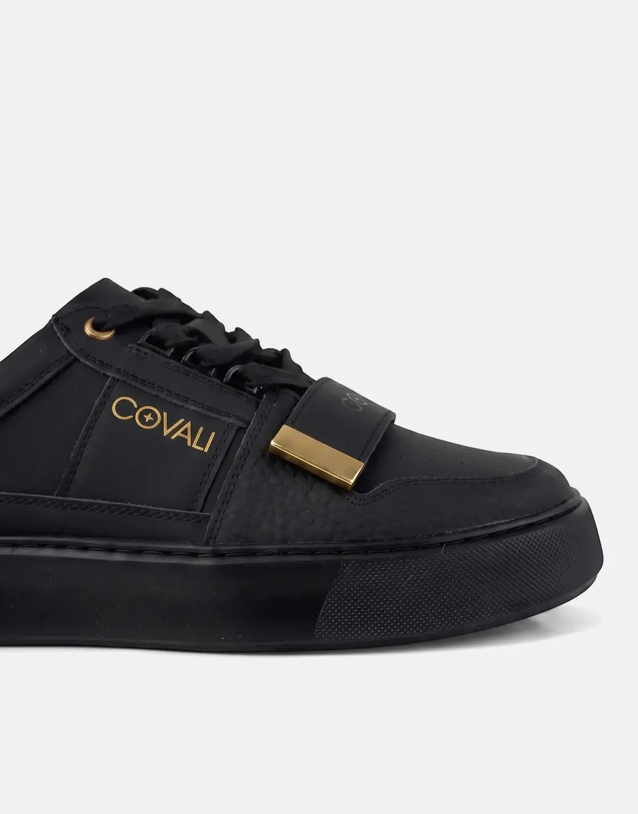 Covali Moda Black Sneakers for men, featuring gold branding, gold bar hardware, and black laces, captured from a side view.