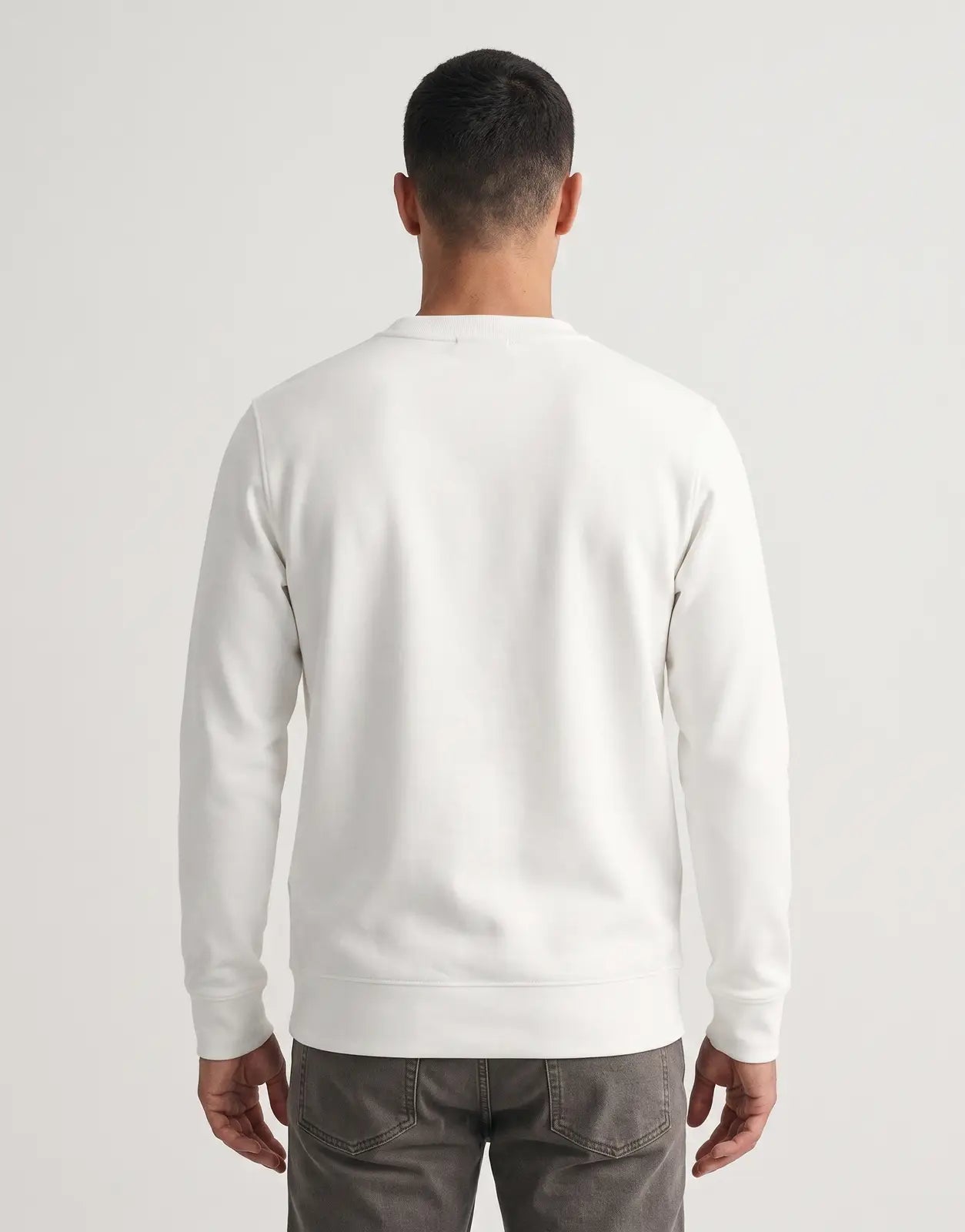 Covali Oro white sweatshirt in a classic crew neck design with long sleeves and ribbed cuffs, displayed from the back.