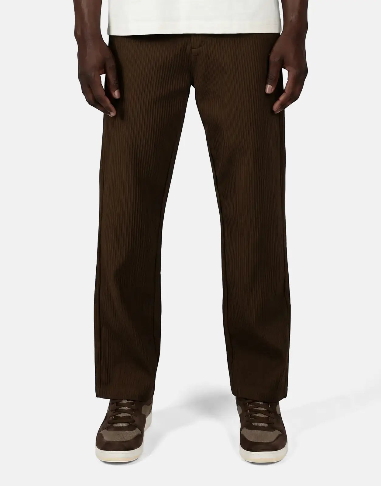 Diadora Asher men's ribbed brown pants shown worn by a model, featuring a straight fit and full-length design.
