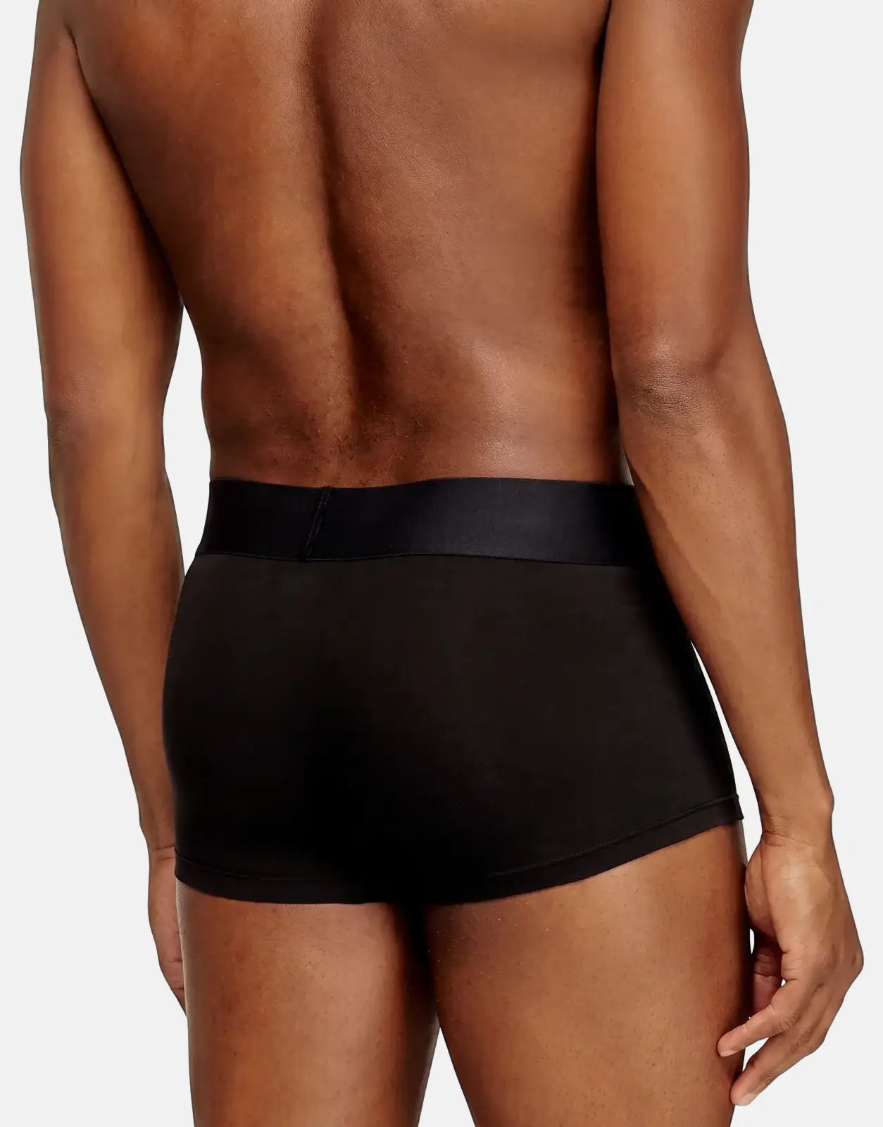 Black Diesel Damien D Pop boxer shorts worn by a man, shown from the back, highlighting the snug fit and elastic waistband.