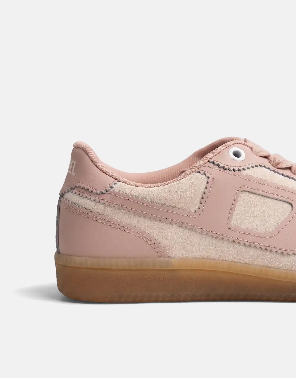 Diesel S-D-Matcha Low Sneakers in pink and cream suede and leather with a gum sole, shown in a side profile.