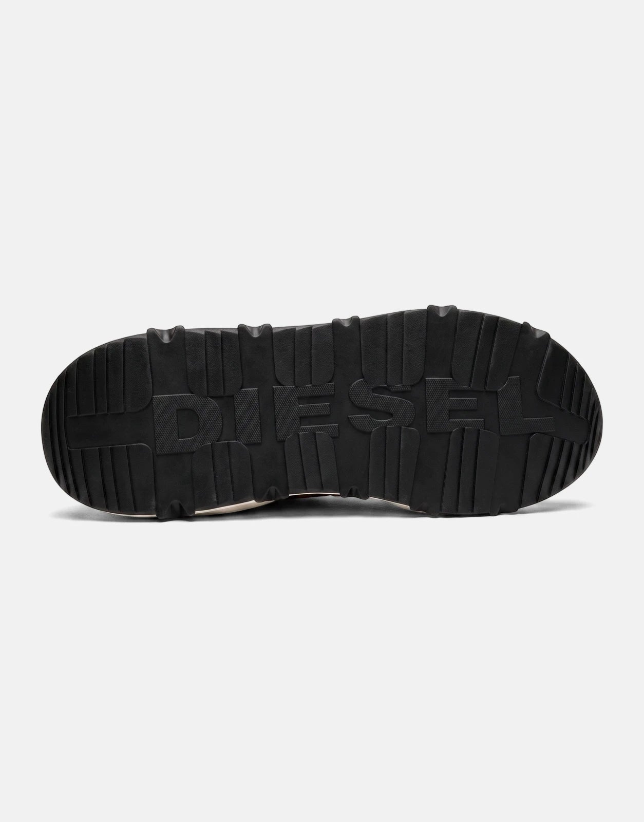 Black textured sole of a Diesel S-Savannah Tulu sneaker, featuring the embossed DIESEL logo. View from below.