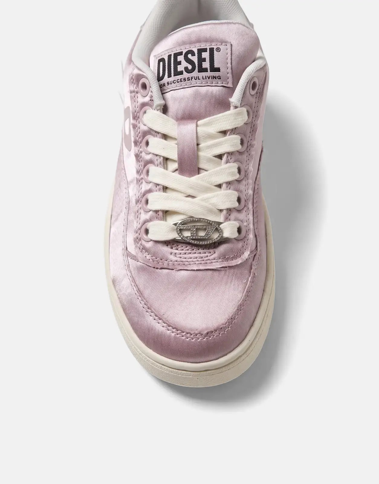 Close-up front view of a pink satin Diesel S-Tracker D Low sneaker with white laces and a branded lace tag.