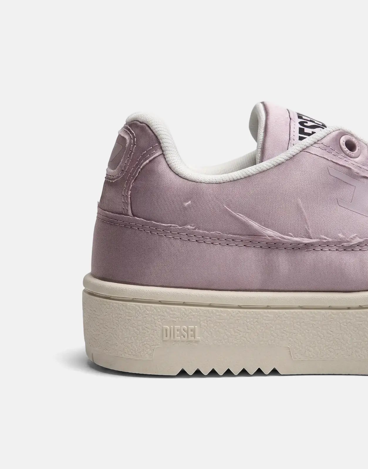 Close-up side view of a purple satin Diesel S-Tracker D Low Sneaker T5093 with white laces and sole.