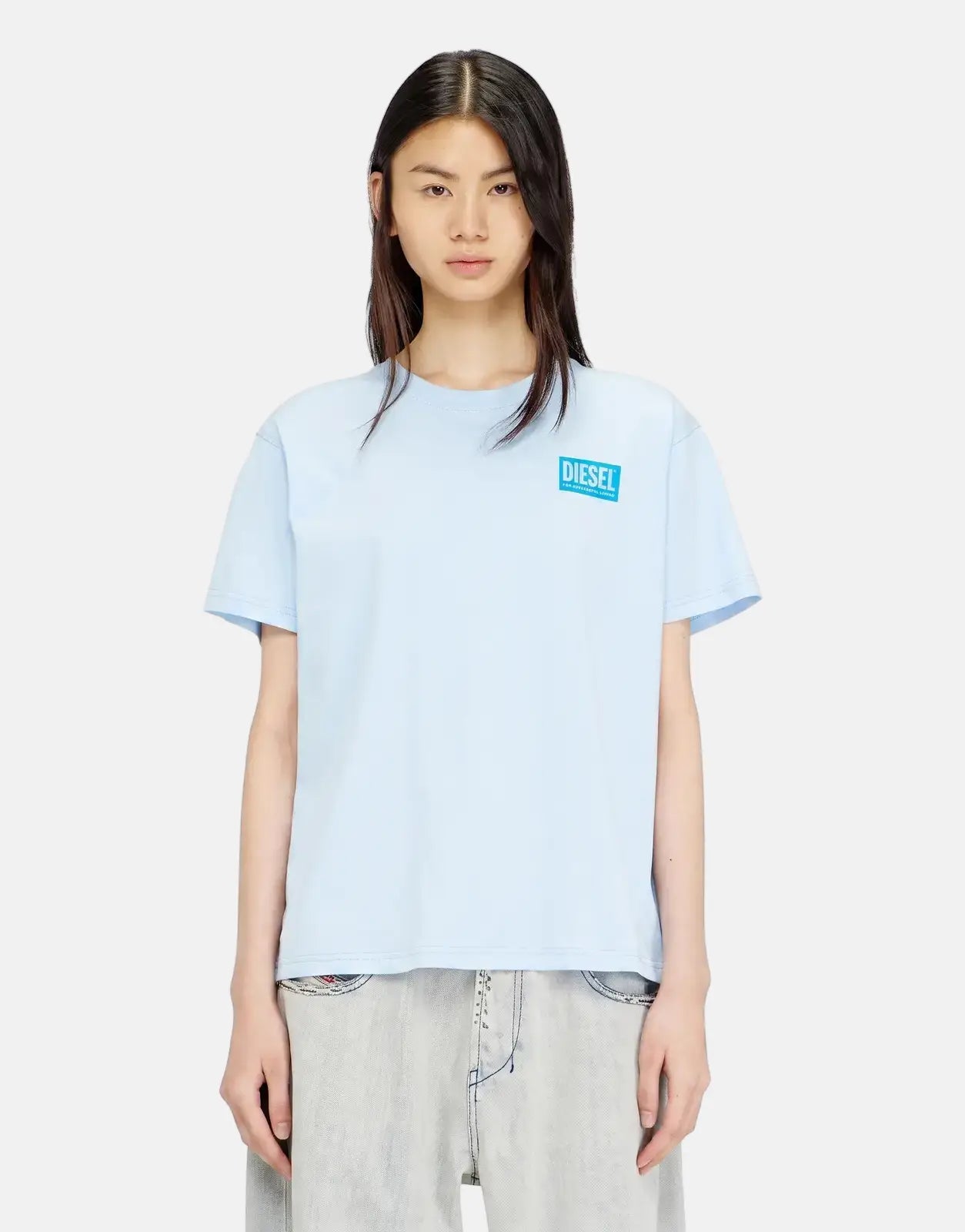 Light blue Diesel T-Normy S6 Regular T-Shirt 8PE with short sleeves and chest logo, worn by a female model.