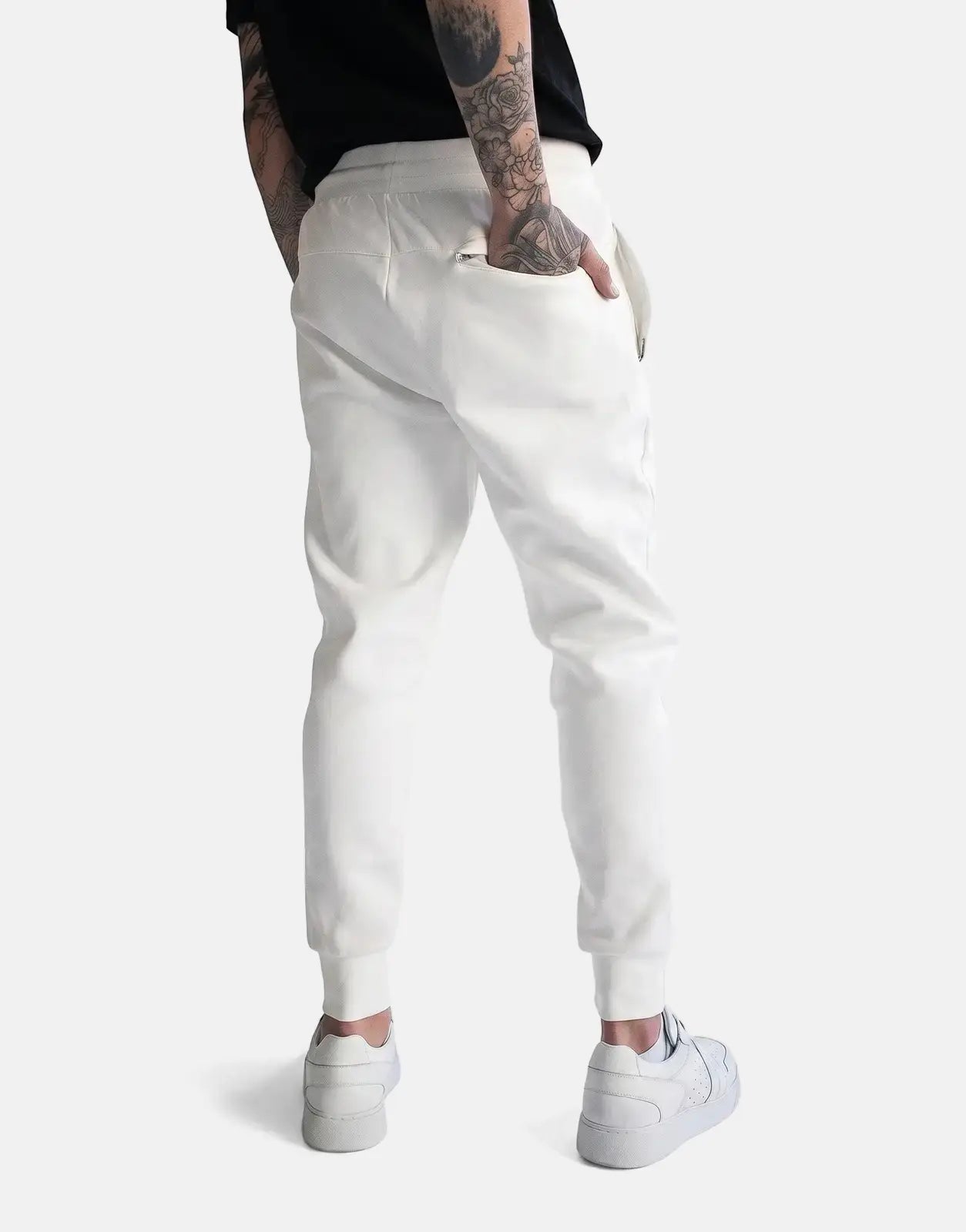 Off-white Fade Essential Sweatpants on a person from the back, showcasing the comfortable fit and subtle details of the
