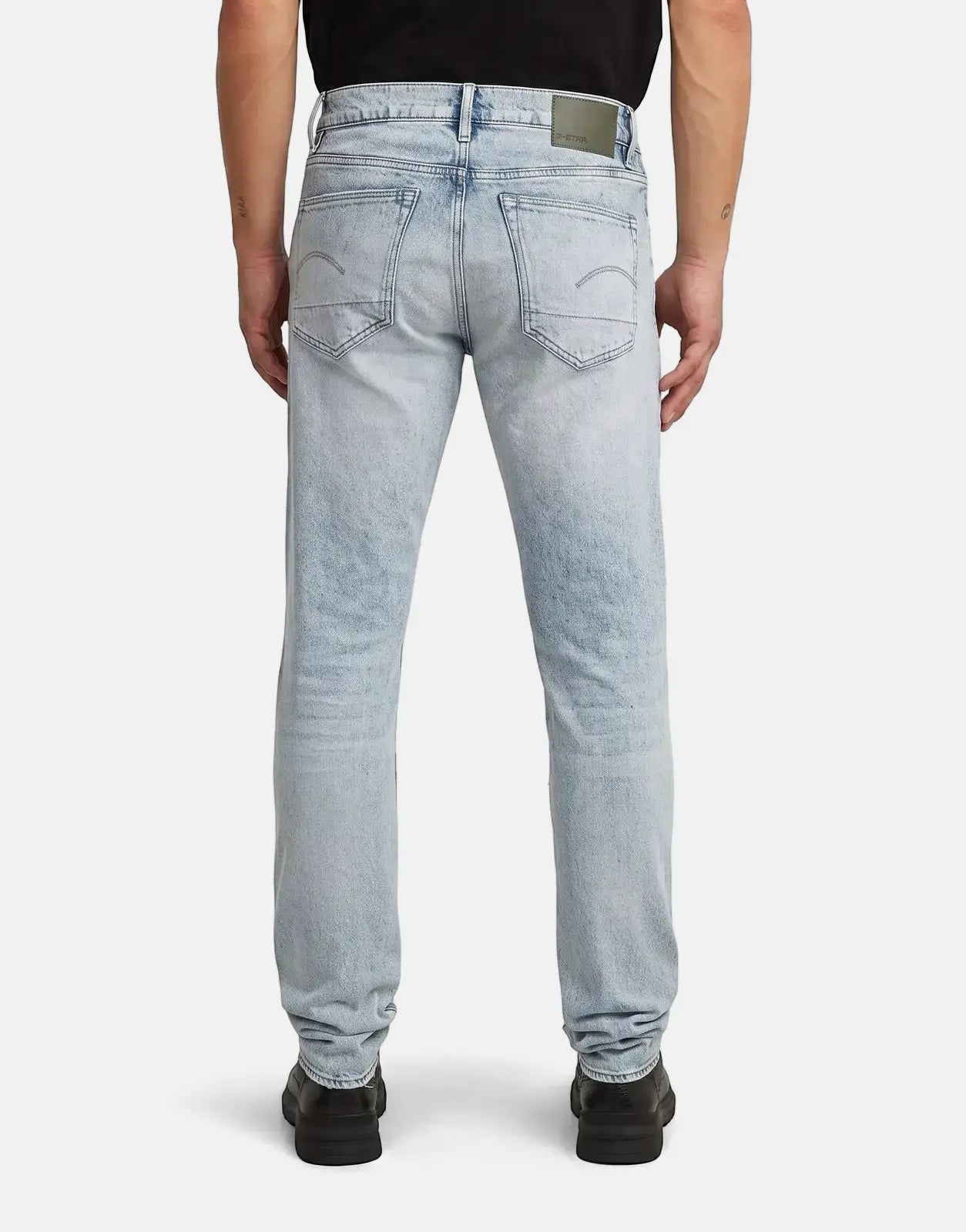Back view of G-Star RAW 3301 Slim Sun Faded Paint Blue men's jeans, showing light wash and back pocket details.