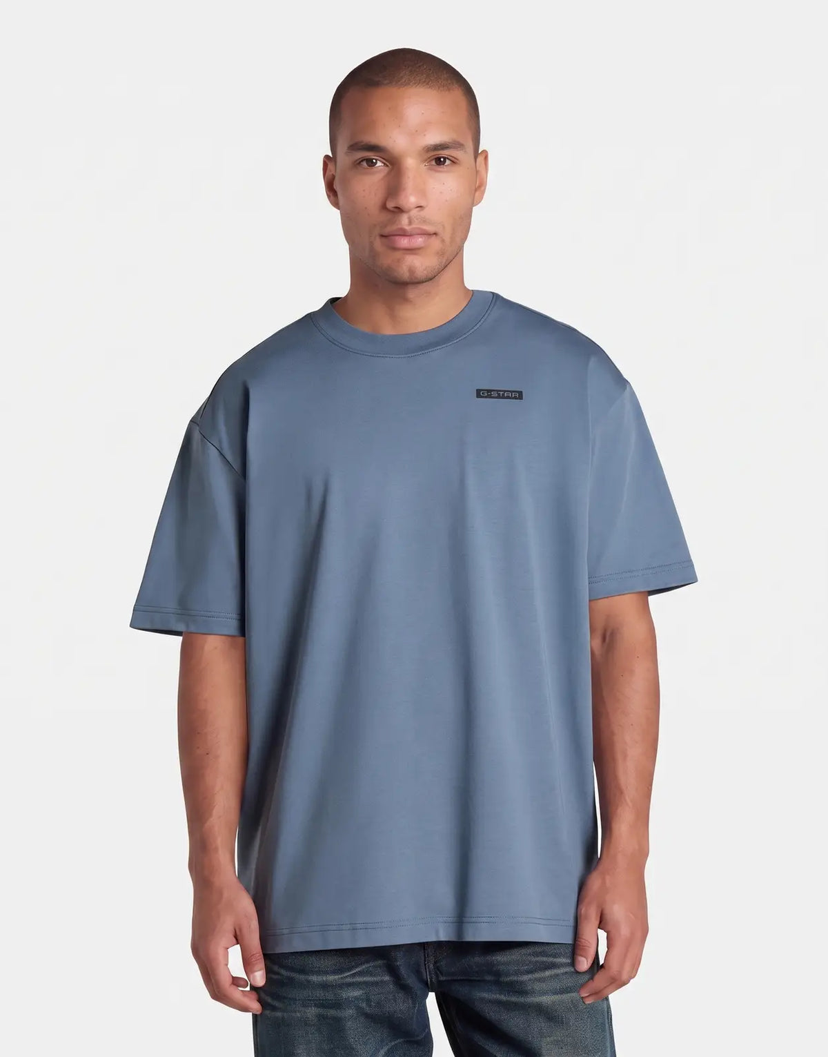 G-Star RAW 89 Back Graphic Relaxed Grit T-Shirt in blue on a male model, front view, short sleeve.
