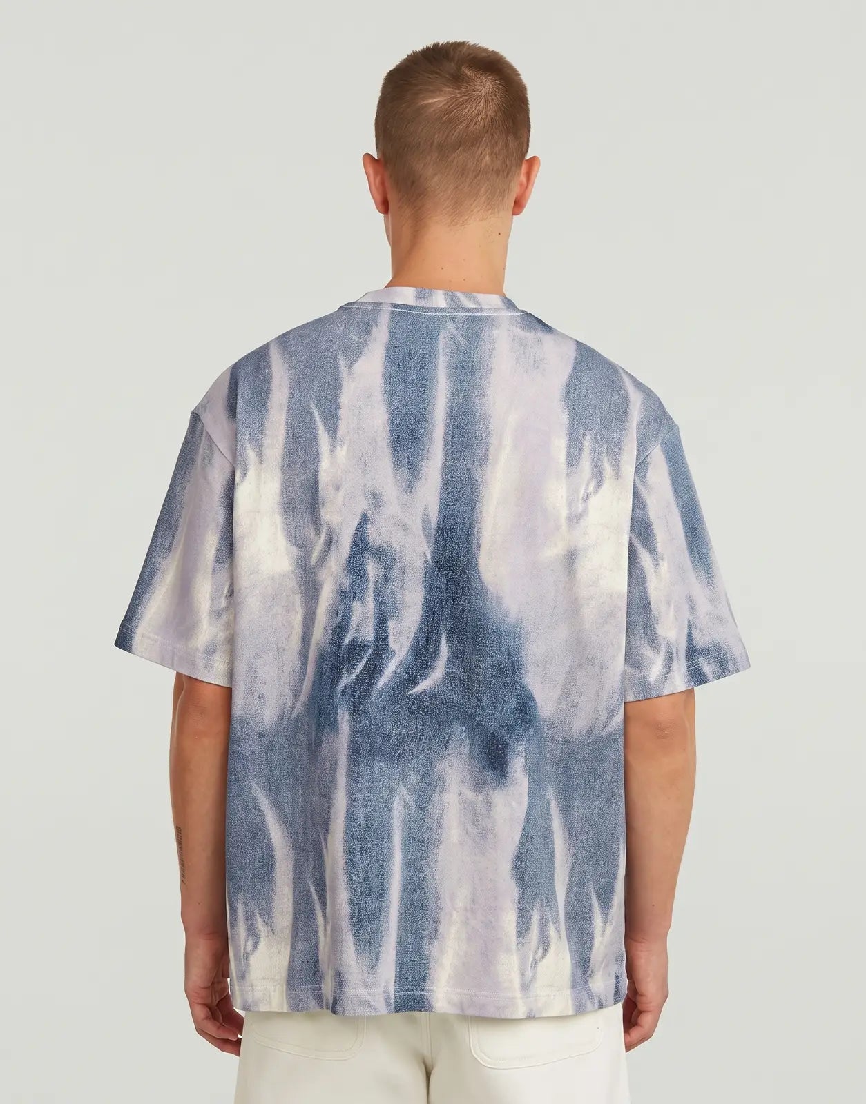 Back view of G-Star RAW All Over Loose Denim Flame T-Shirt, featuring a unique blue and white tie-dye flame pattern.