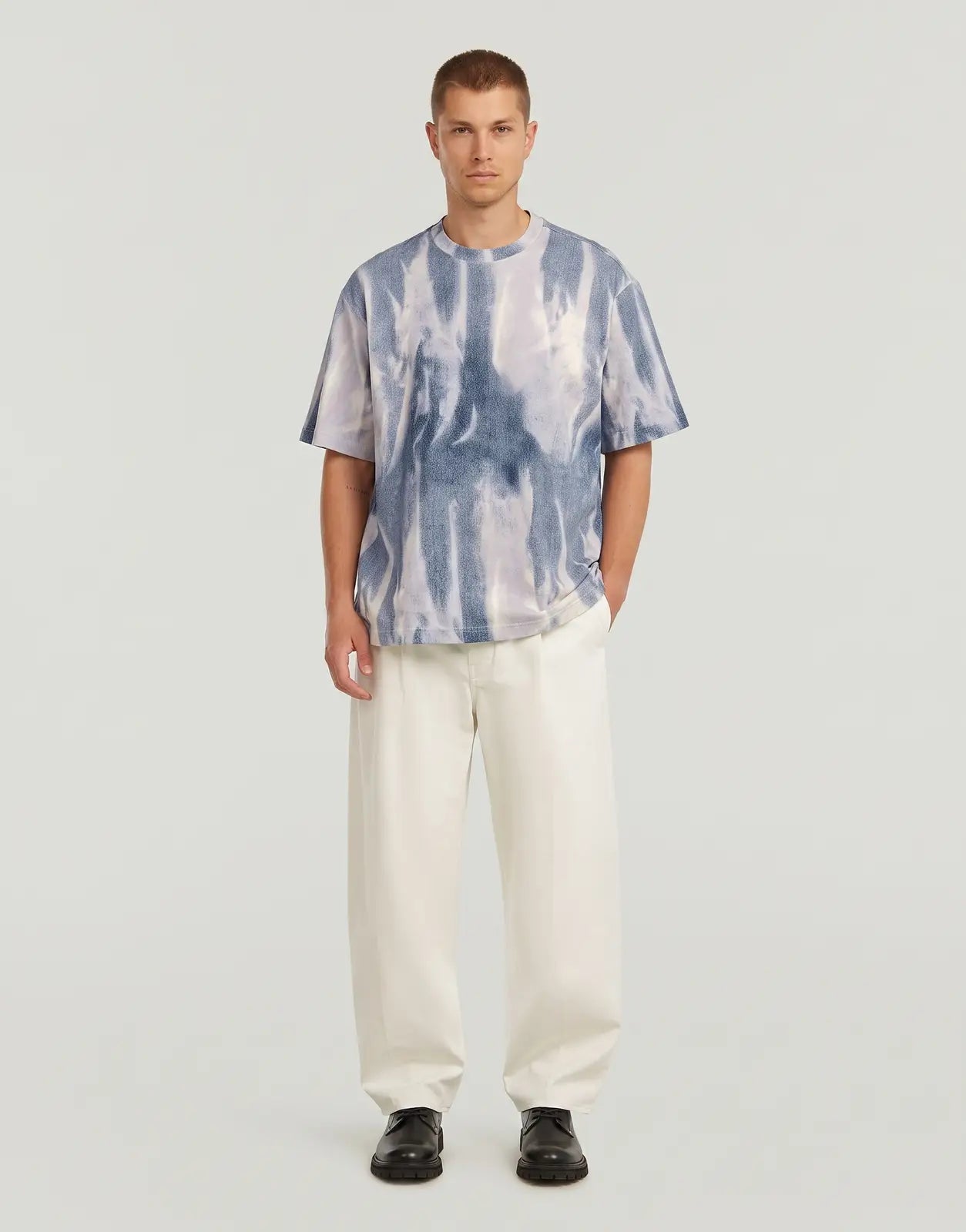 Men's G-Star RAW All Over Loose Denim Flame T-Shirt featuring a unique blue and white tie-dye pattern, front view.