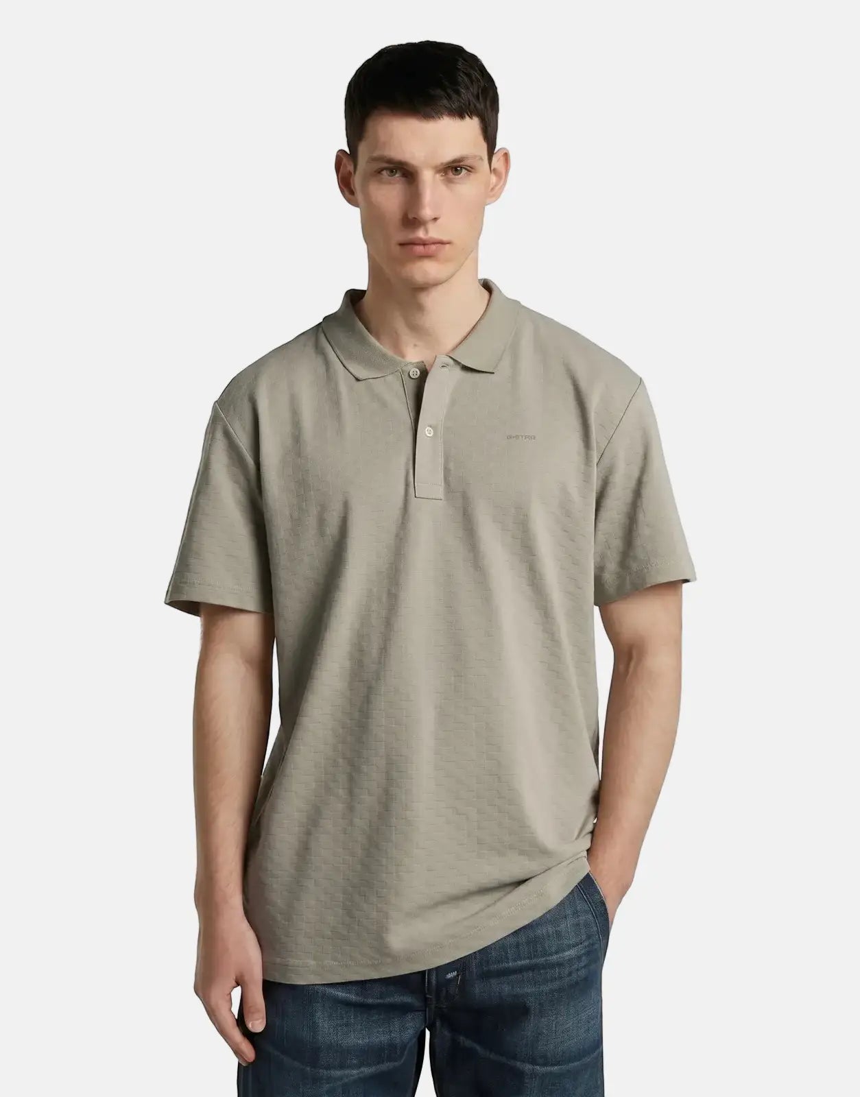 Men's G-Star RAW Core Regular Jacquard Polo Shirt in elephant skin color, front view, worn by a model.