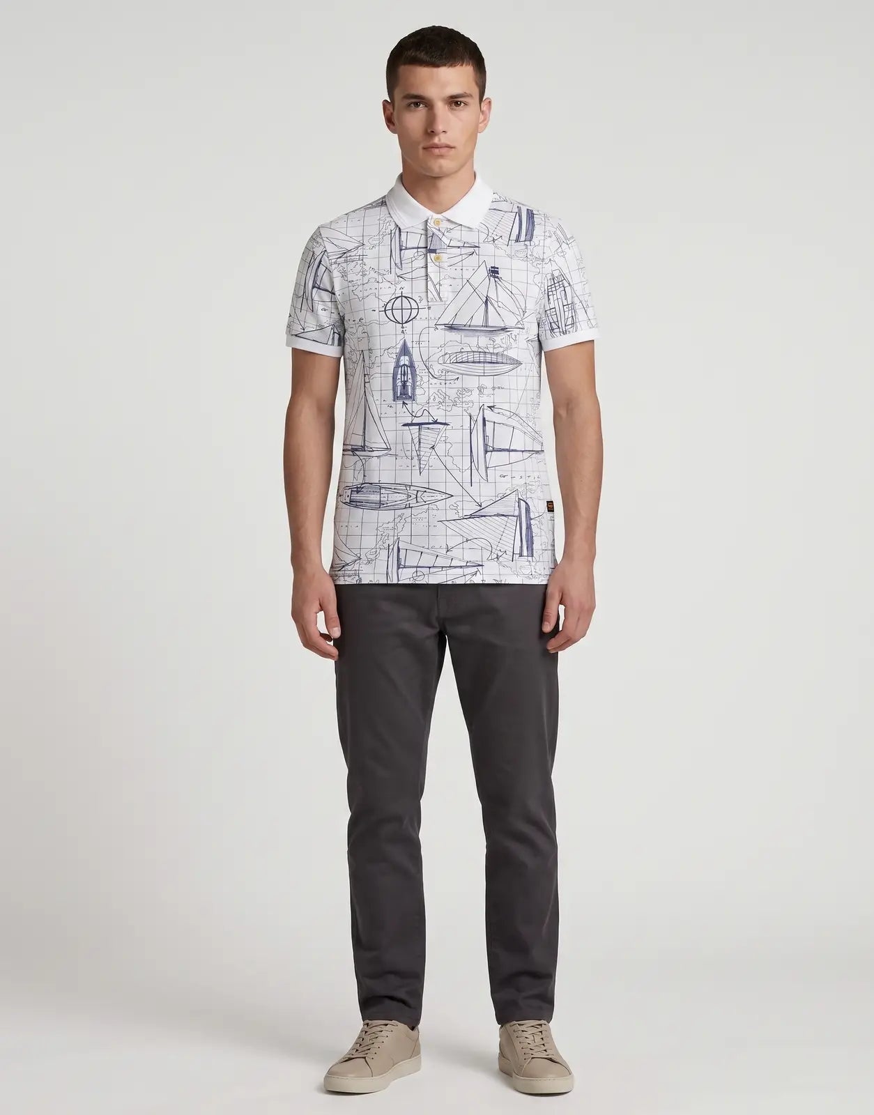 Men's G-Star RAW Dunda Slim AOP White Polo Shirt with a distinctive blue nautical map and boat illustration print.