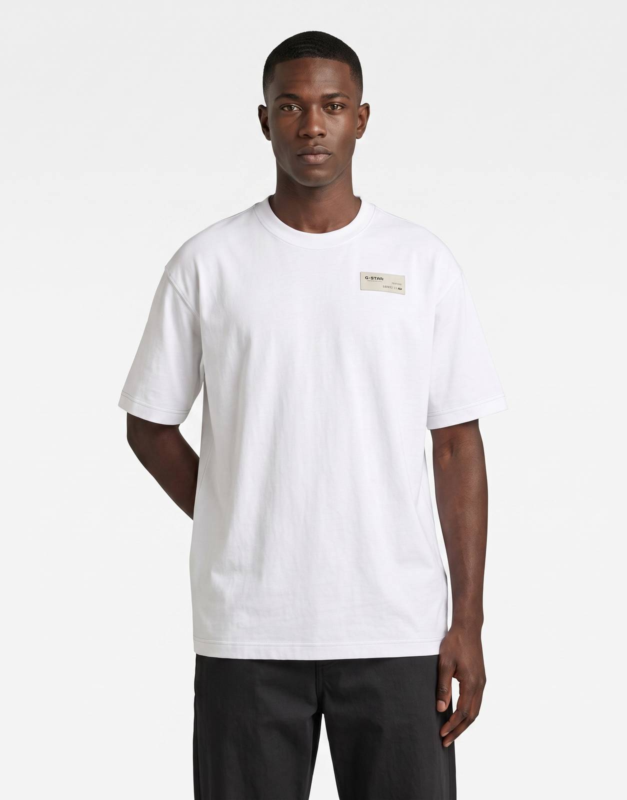 A G-Star RAW HB Badge Relaxed White T-Shirt for men, showcasing its comfortable relaxed fit and subtle chest badge detail.