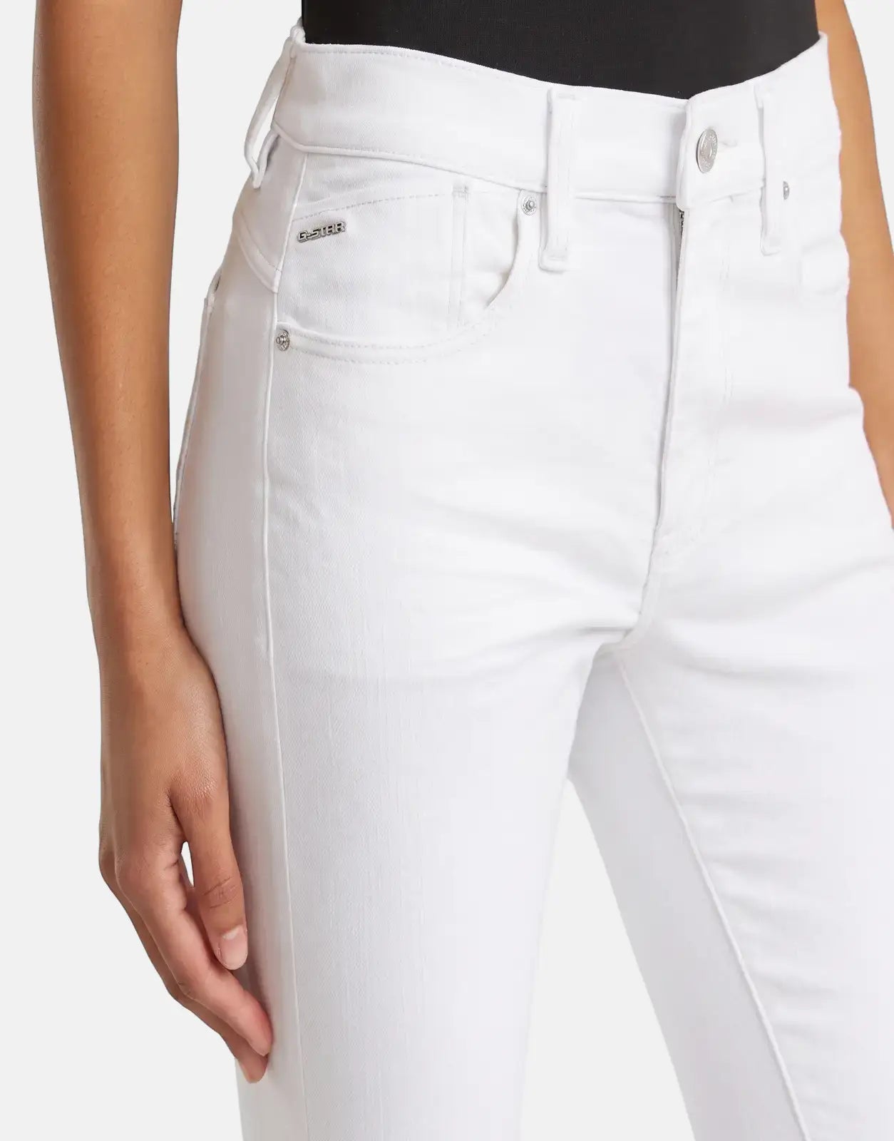 Close-up of G-Star RAW Lhana Skinny Paper White Jeans on a model, showcasing the white denim fabric and skinny fit.