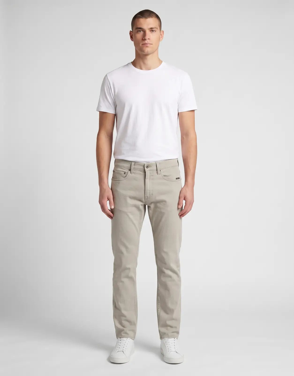 Front view of G-Star RAW Mosa Straight Elephant Skin Jeans on a male model, showcasing the light beige color and straight