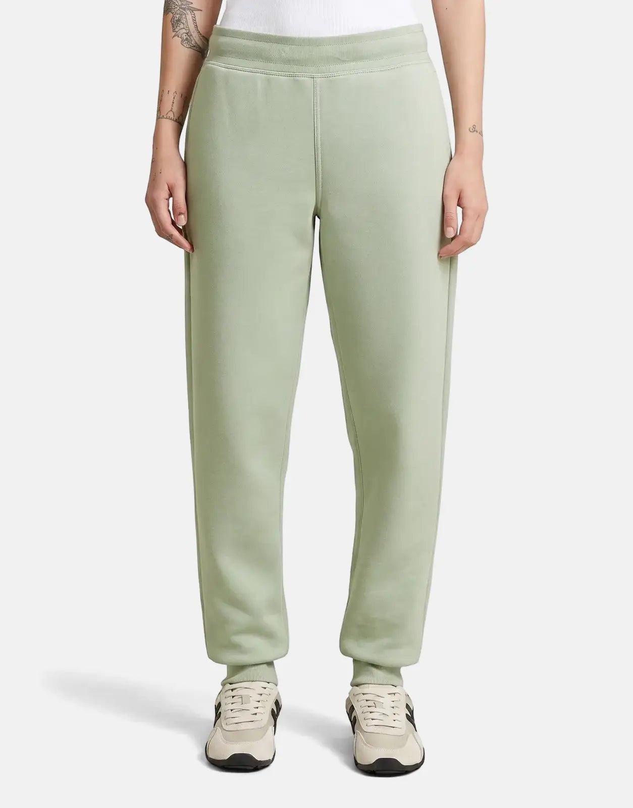 G-Star RAW Premium Core 2.0 Pale Green Sweatpants, featuring a ribbed waistband and cuffs, worn by a model standing.
