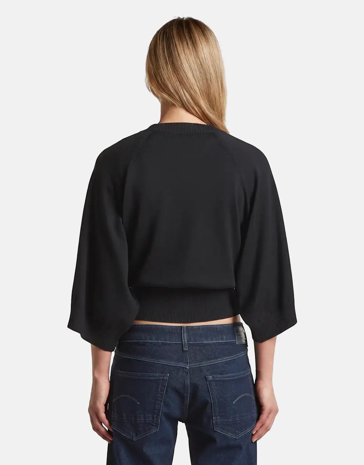 Back view of G-Star RAW Raglan Top in dark black, cropped knit pullover with raglan sleeves and ribbed hem.