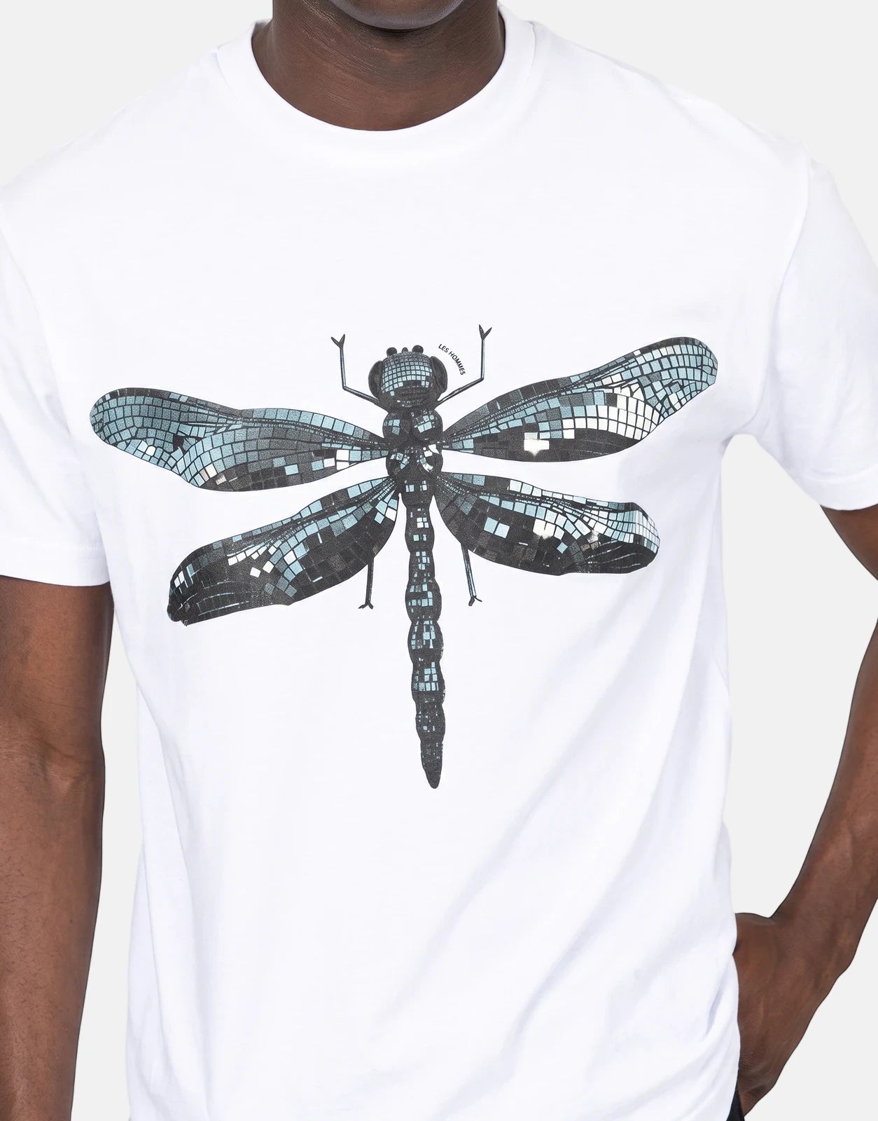 Les Hommes Dragonfly White T-shirt with a detailed mosaic-style dragonfly print, worn by a model.