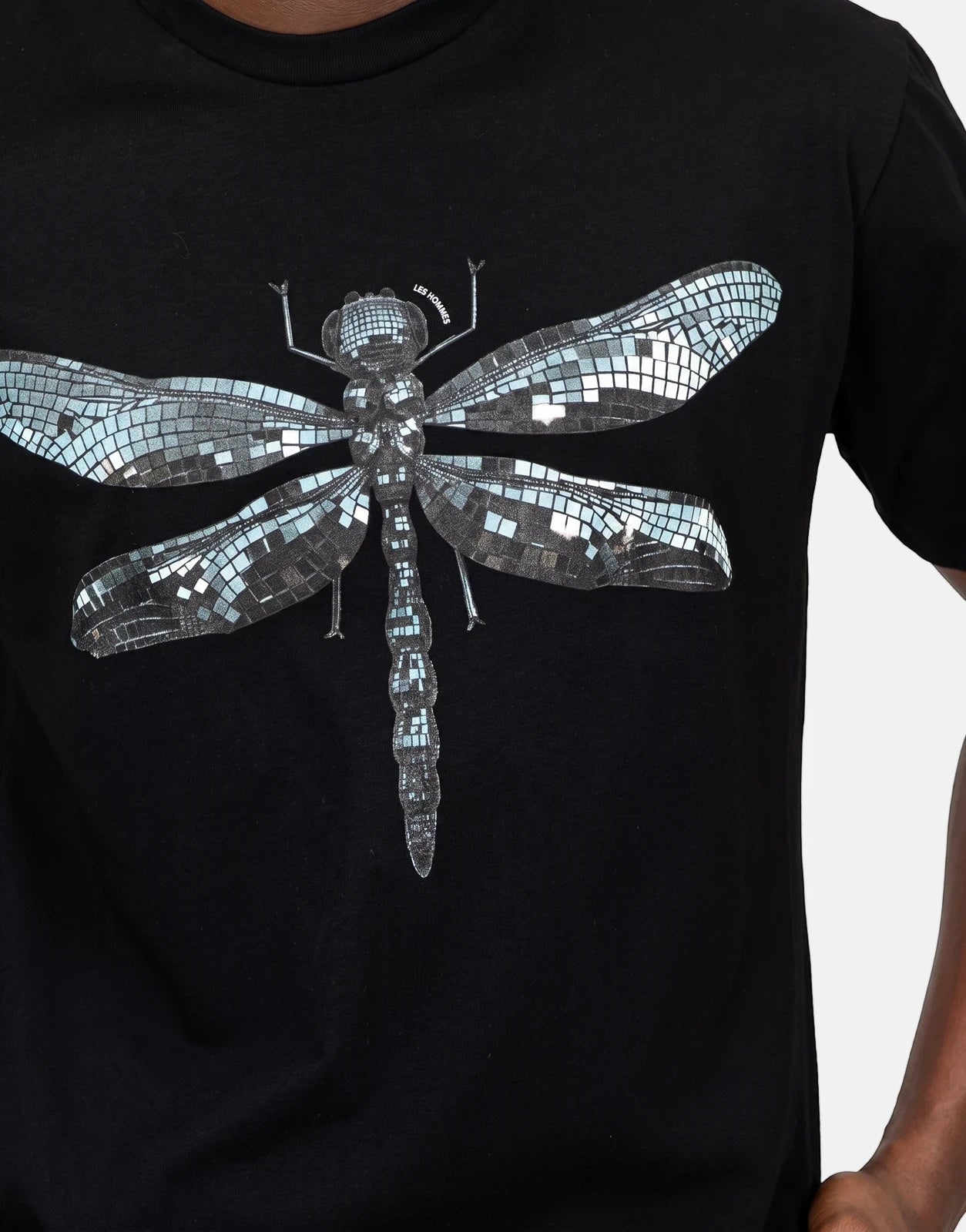 Black Les Hommes t-shirt for men, featuring a shimmering metallic mosaic dragonfly graphic on the chest.