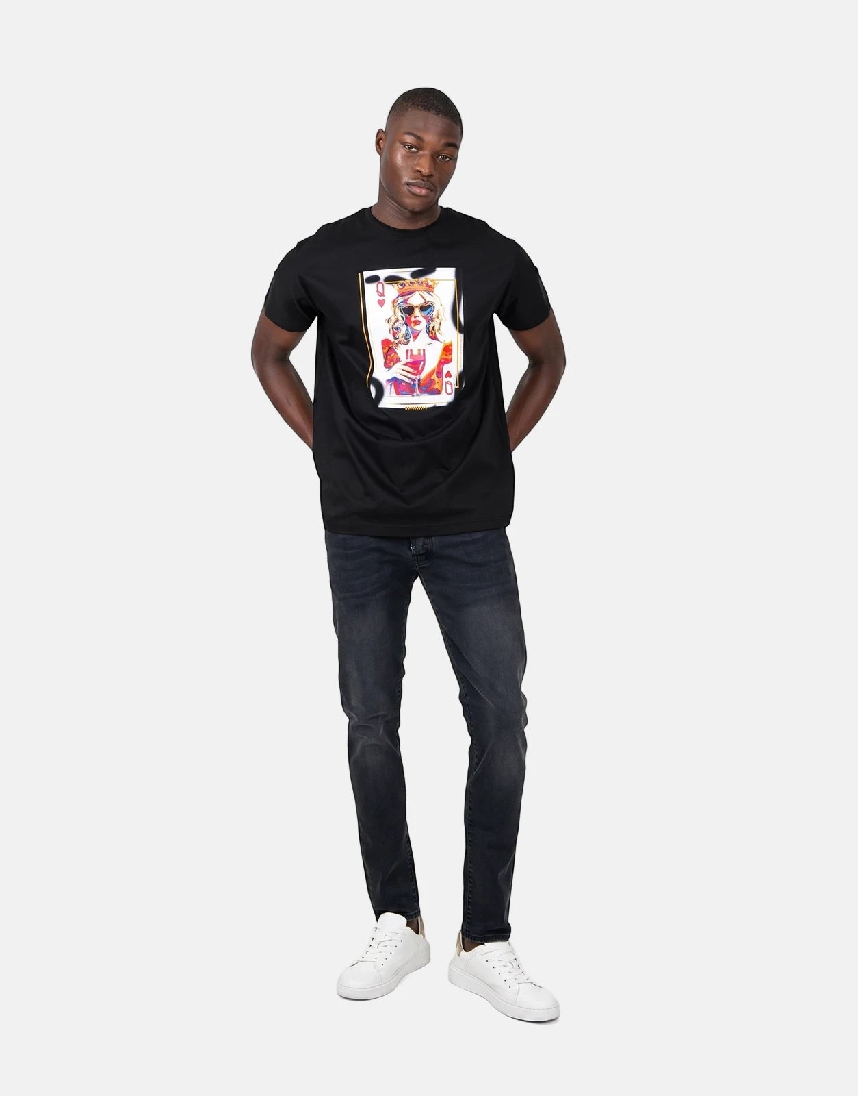 Black Les Hommes Queen Of Hearts t-shirt worn by a male model, featuring a vibrant playing card graphic on the chest.