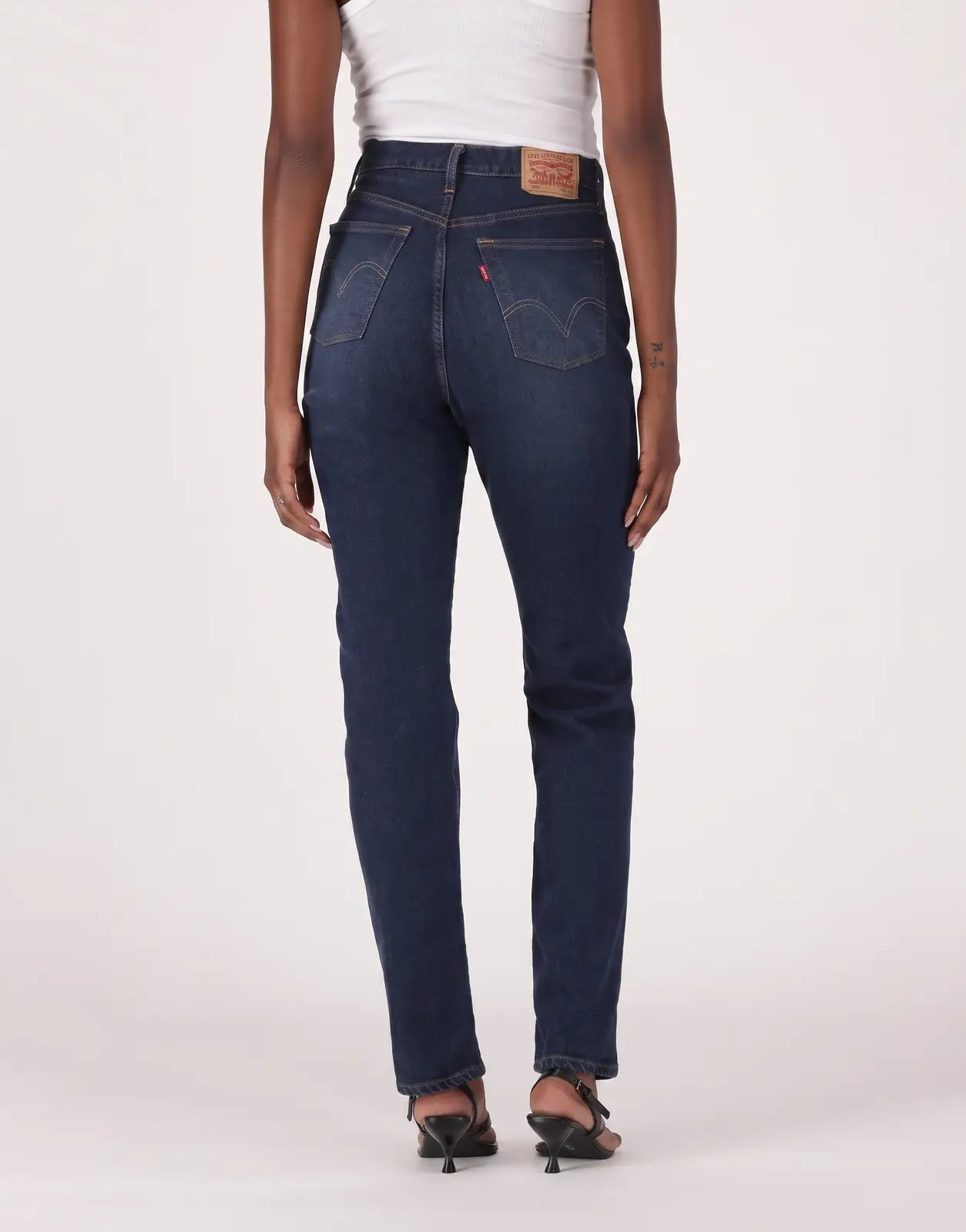 Dark blue Levis 501 Ladies Time Take jeans, presented from the back view on a model, showcasing the classic denim wash and