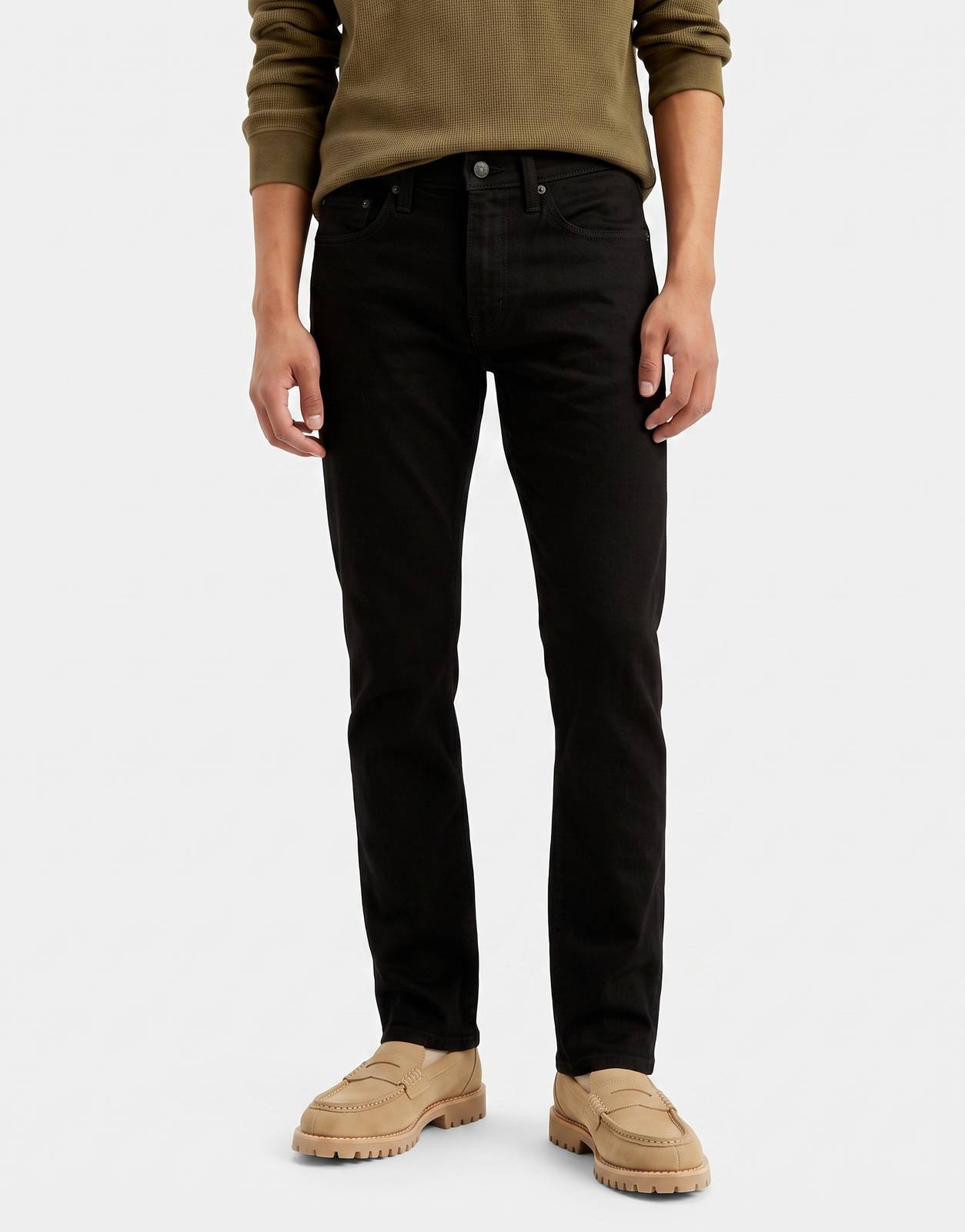Levi's 511 Slim Black Jeans for men, made of black denim, shown on a model with an olive green henley and tan loafers.