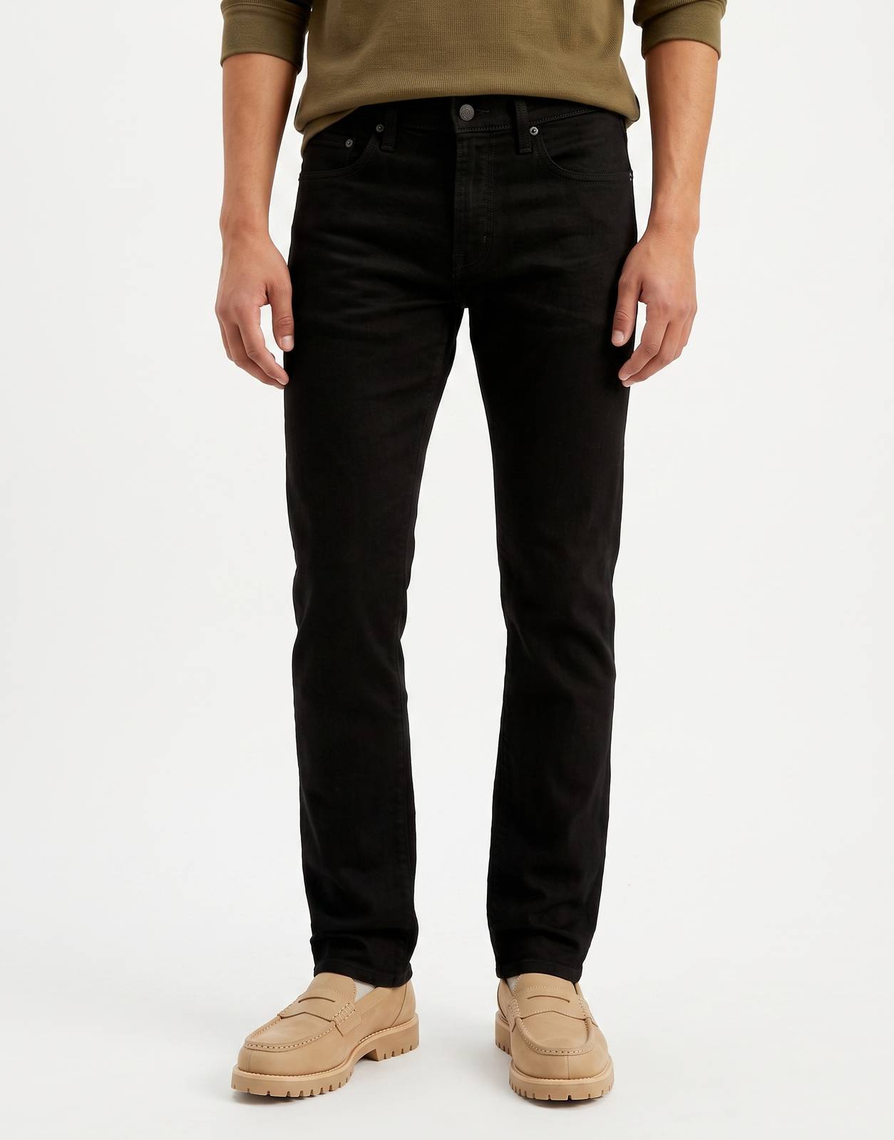 A male model wearing Levi's 511 Slim Black Jeans, showcasing the modern slim fit and classic denim fabric on a white
