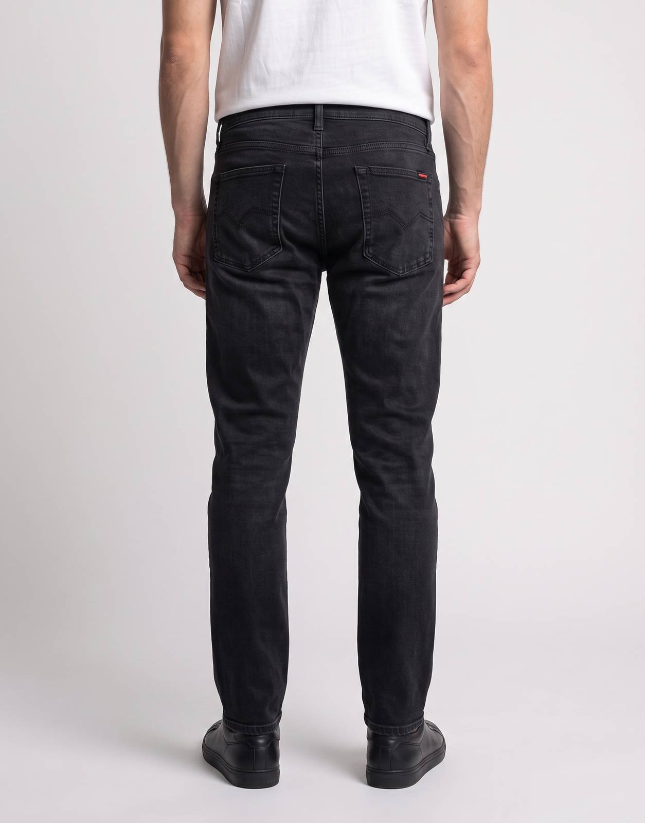 Men's Replay Hyperflex Colour Ed. black denim jeans, shown from the back, highlighting the fabric, fit, and pocket details.