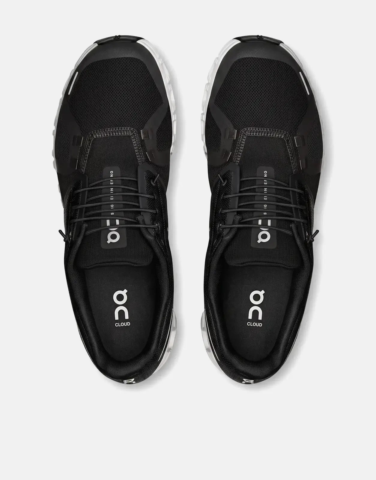 A top-down view of a pair of black and white On Men's Cloud 6 running sneakers with mesh uppers.