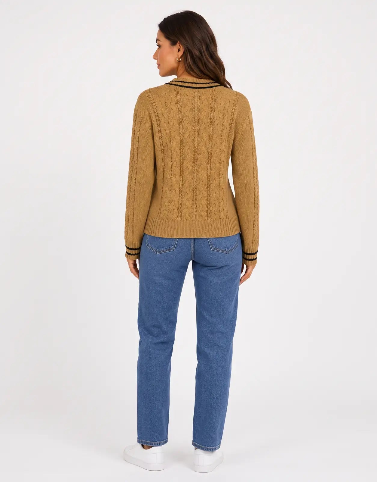 Back view of a Polo Jane LS V-Neck Camel Cable Knitwear, featuring a textured cable knit pattern and striped cuffs.