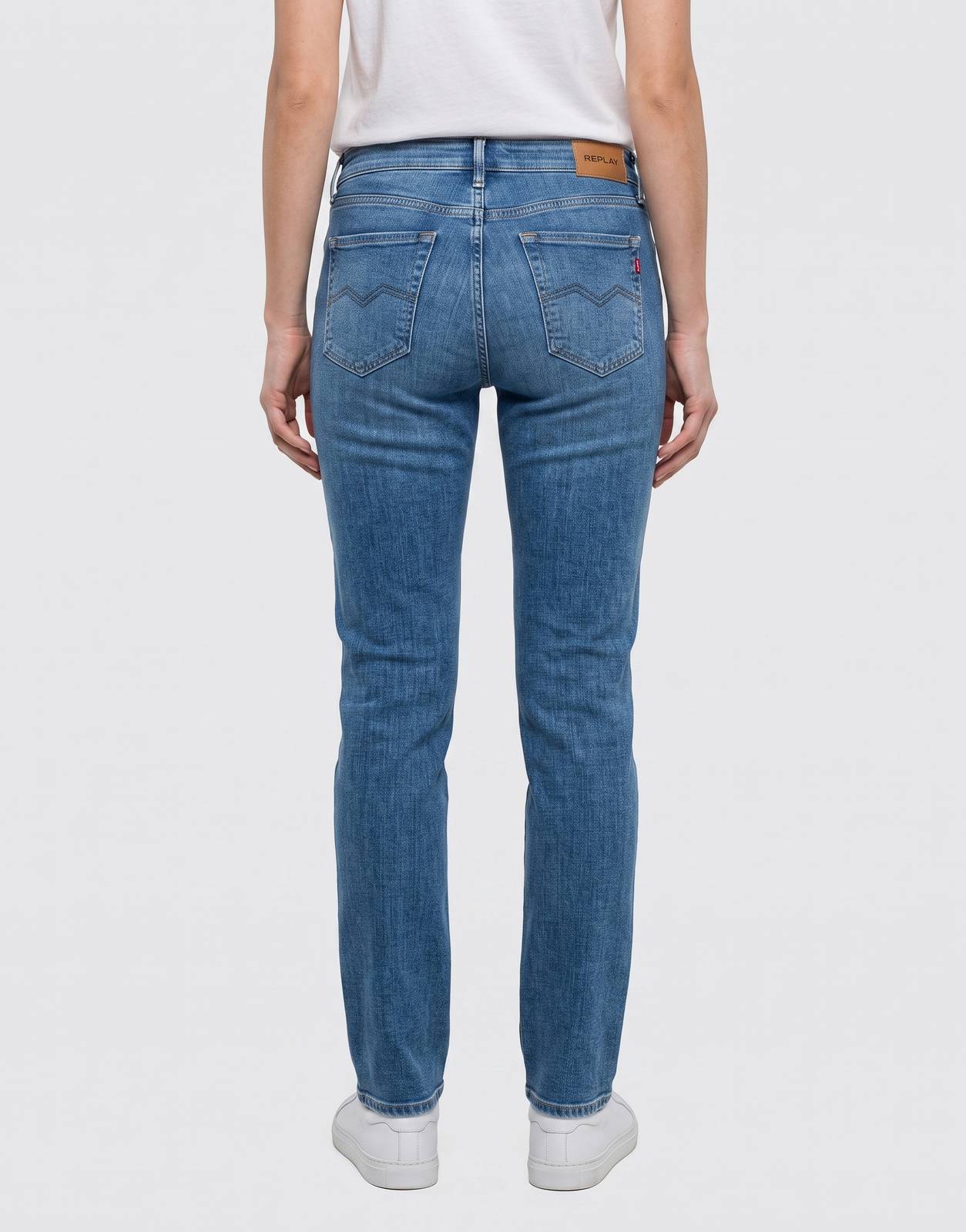Replay Ladies New Luz Jeans in a classic medium blue wash, featuring a slim fit and detailed back pockets with brand labels.