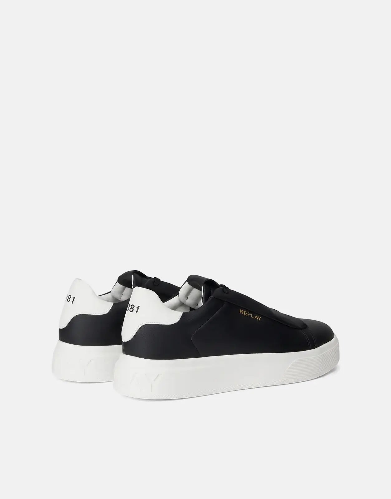 A pair of Replay Notting Medium black and white sneakers with white platform soles, viewed from the side-rear angle.