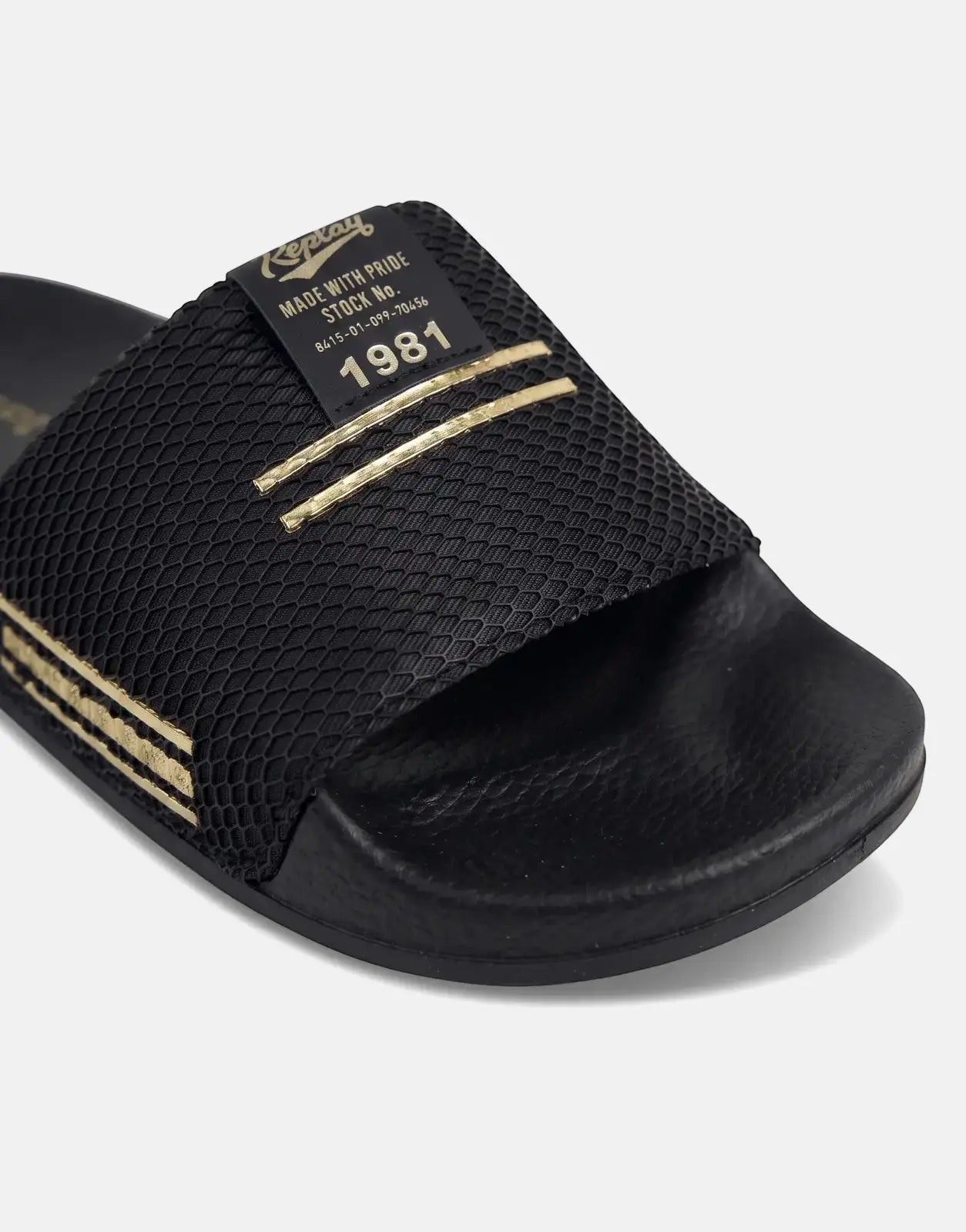 Replay Up Trap slide sandal in black and platino gold, featuring a textured strap with the Replay logo and '1981' details.